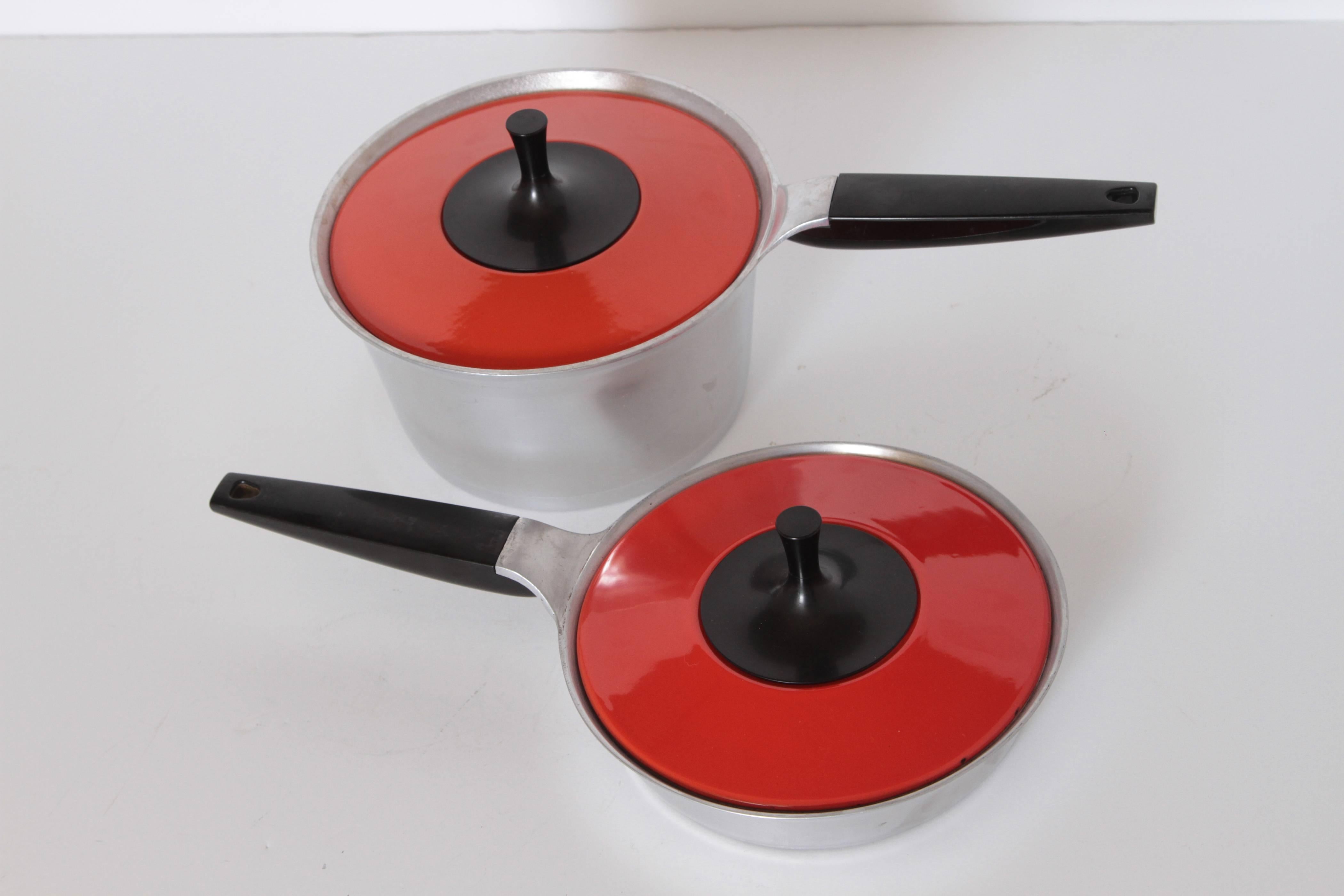 Mid-Century Modernist Peter Muller-Munk, Collection Griswold Symbol Cook Ware, circa 1962. Cookware. 

12 Covered pieces, plus one extra lid.  Only 9 pictured in the main pic.  Please see rest of pics for total.  Plus one loose orange lid.  13