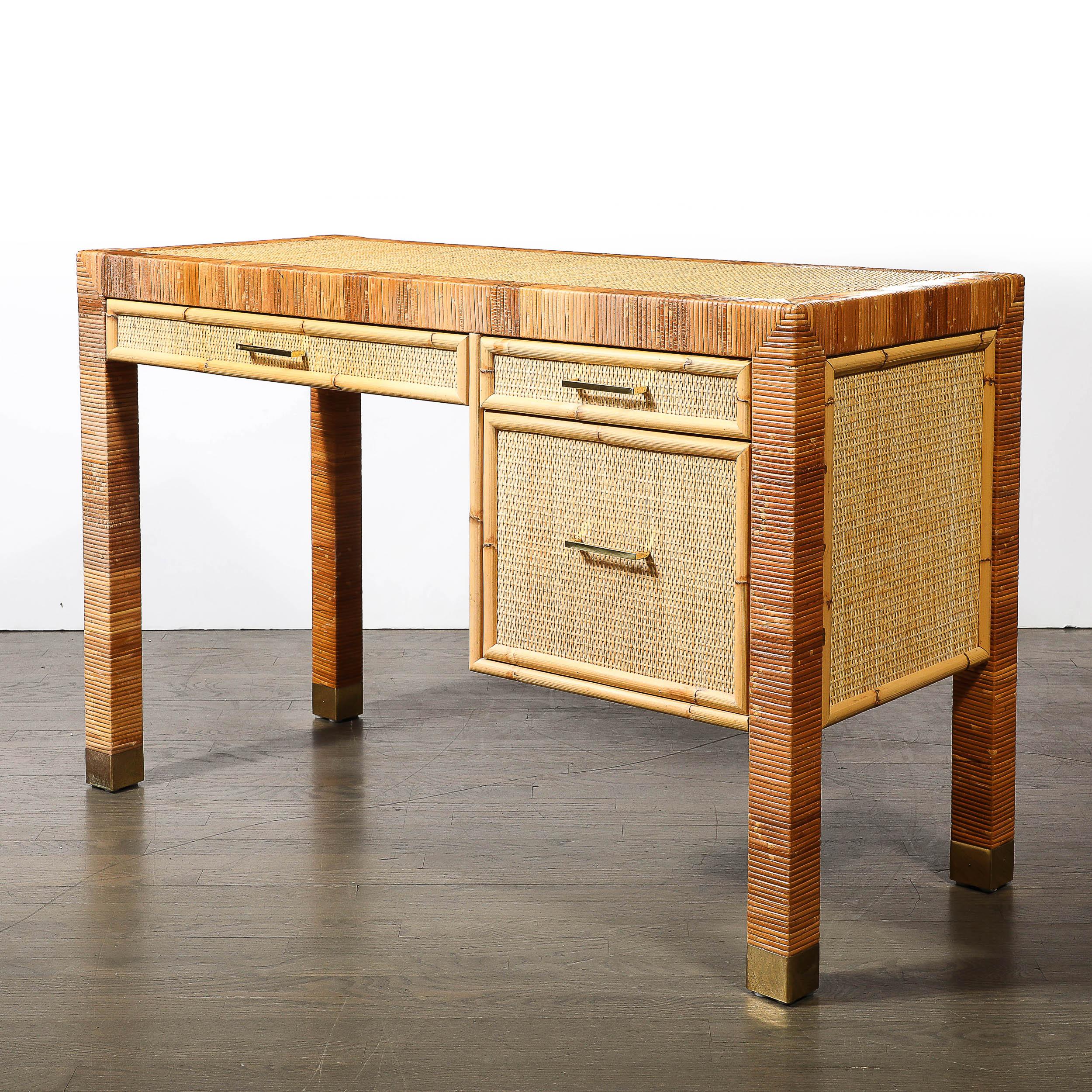 This elegant Mid-Century Modernist desk, crafted by the esteemed Bielecky Brothers, exudes sophistication with its meticulous rattan and bamboo wrapping. Made in America around 1970, the desk features clean lines and a streamlined form, embodying