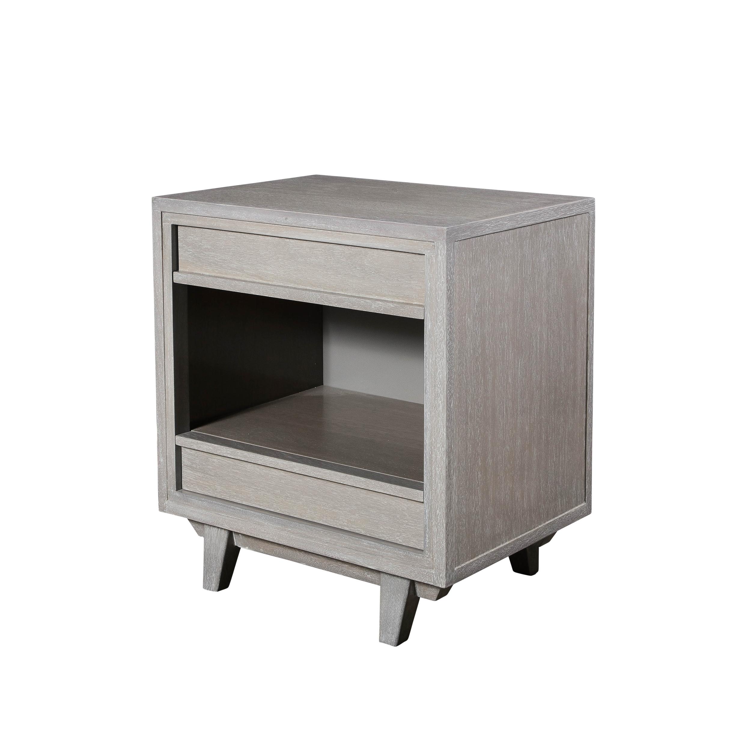 This pair of Mid-Century Modernist Rectilinear Nightstands in Silver Cerused Walnut originate from the United States circa 1960. Featuring a beautifully proportioned rectangular design with drawers located on the top and bottom thirds of the piece,