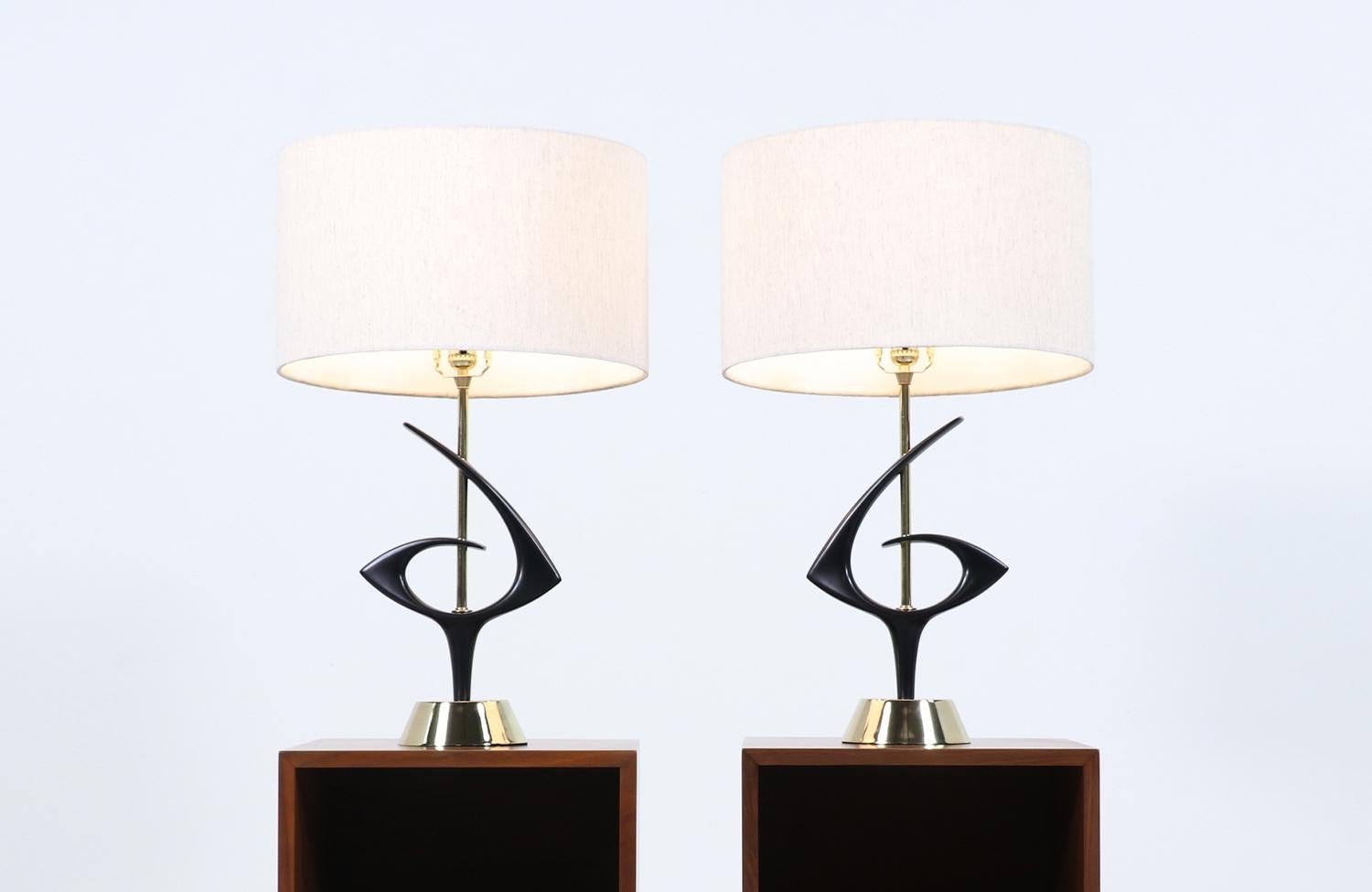Dimensions:

27.50 in. H x 9.50 in. W x 6 in. D
Lamp Shades: 10 in. H x 17 in. W.

________________________________________

Transforming a piece of Mid-Century Modern furniture is like bringing history back to life, and we take this journey with