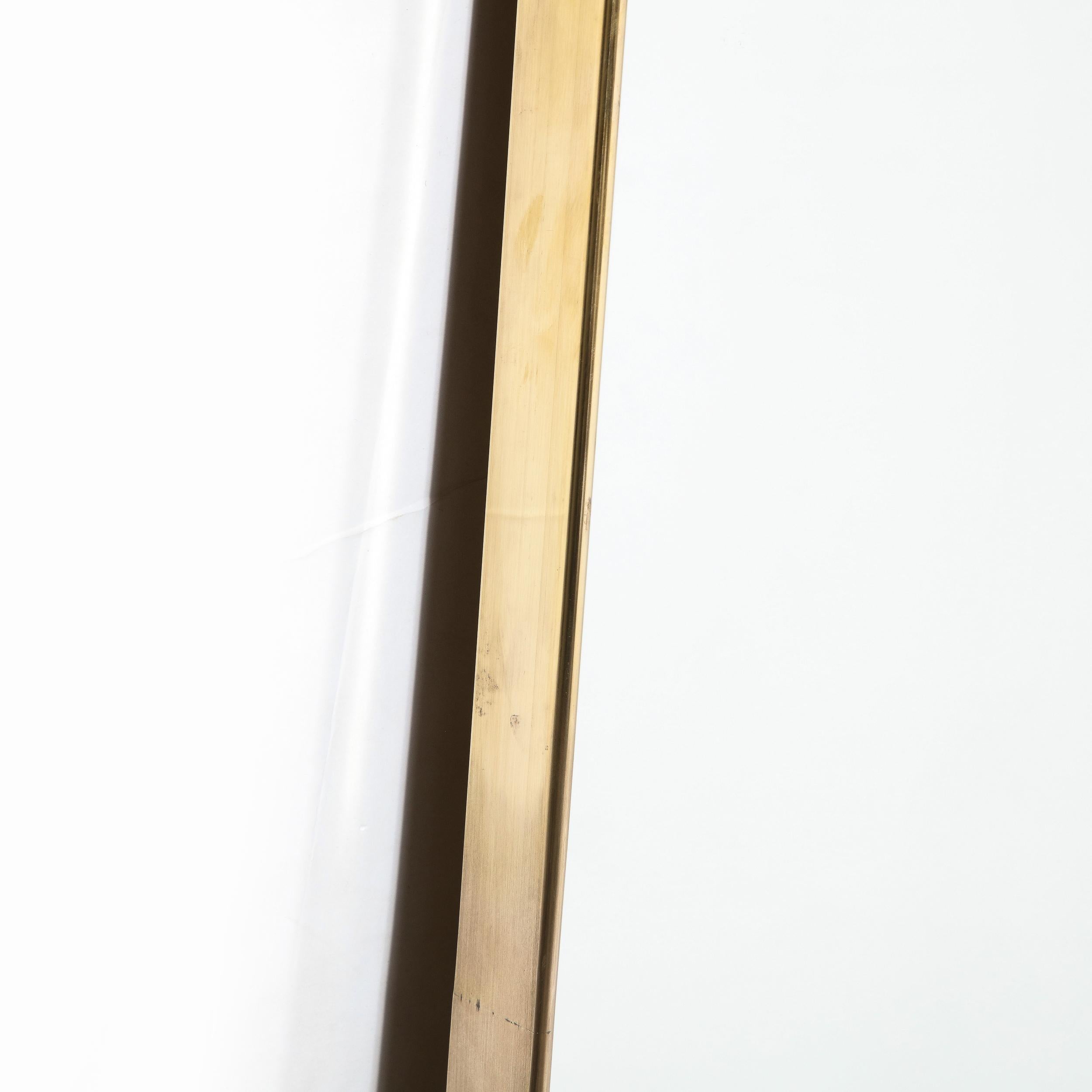 Mid-Century Modernist Shield Form Polished Brass Wrapped Mirror In Excellent Condition For Sale In New York, NY