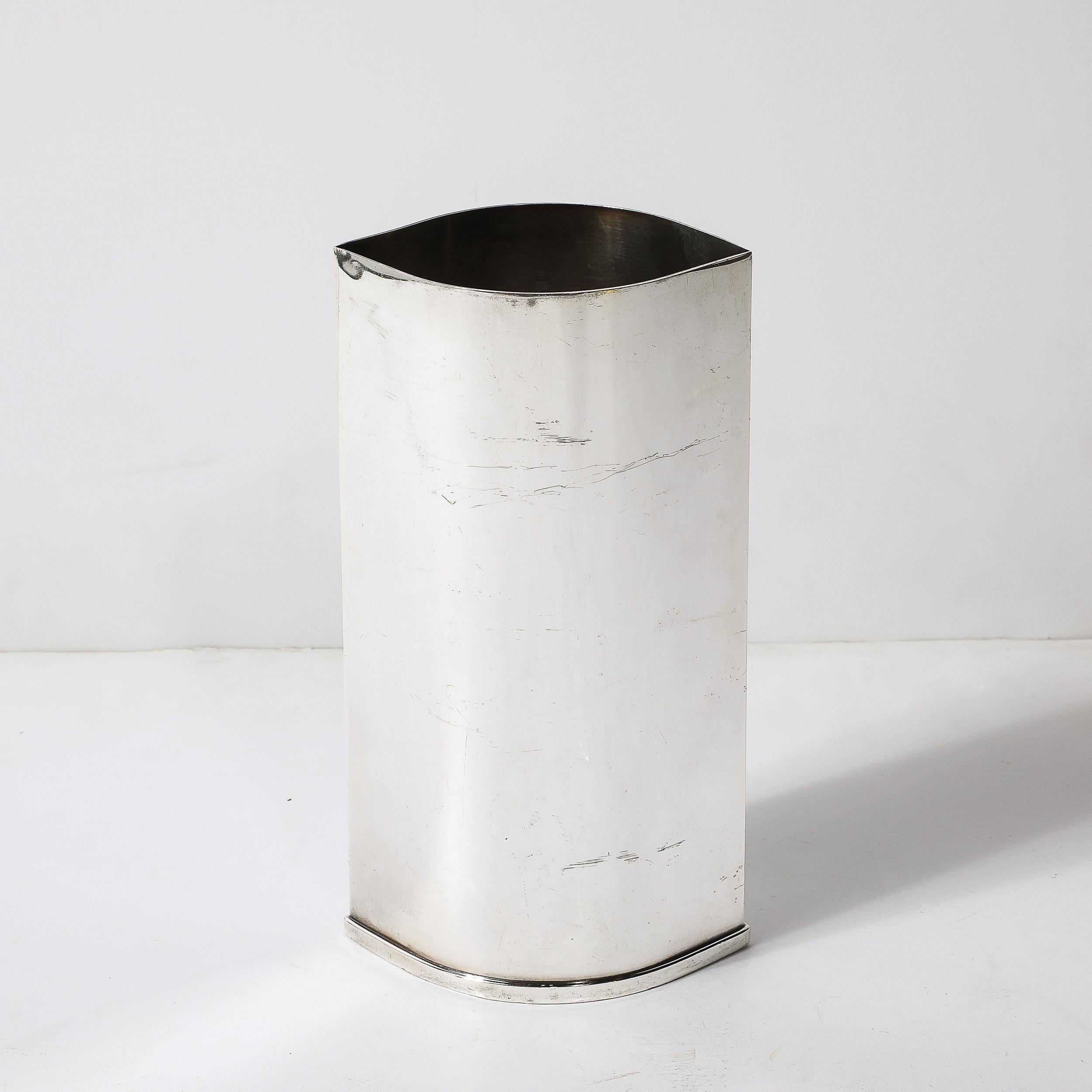 This exquisite mid-century modernist silver-plate ovoid form botanical vase, signed by St. James from Brazil, stands as a testament to the sleek and organic forms characteristic of the era. The vase's elegant ovoid shape and refined, the understated