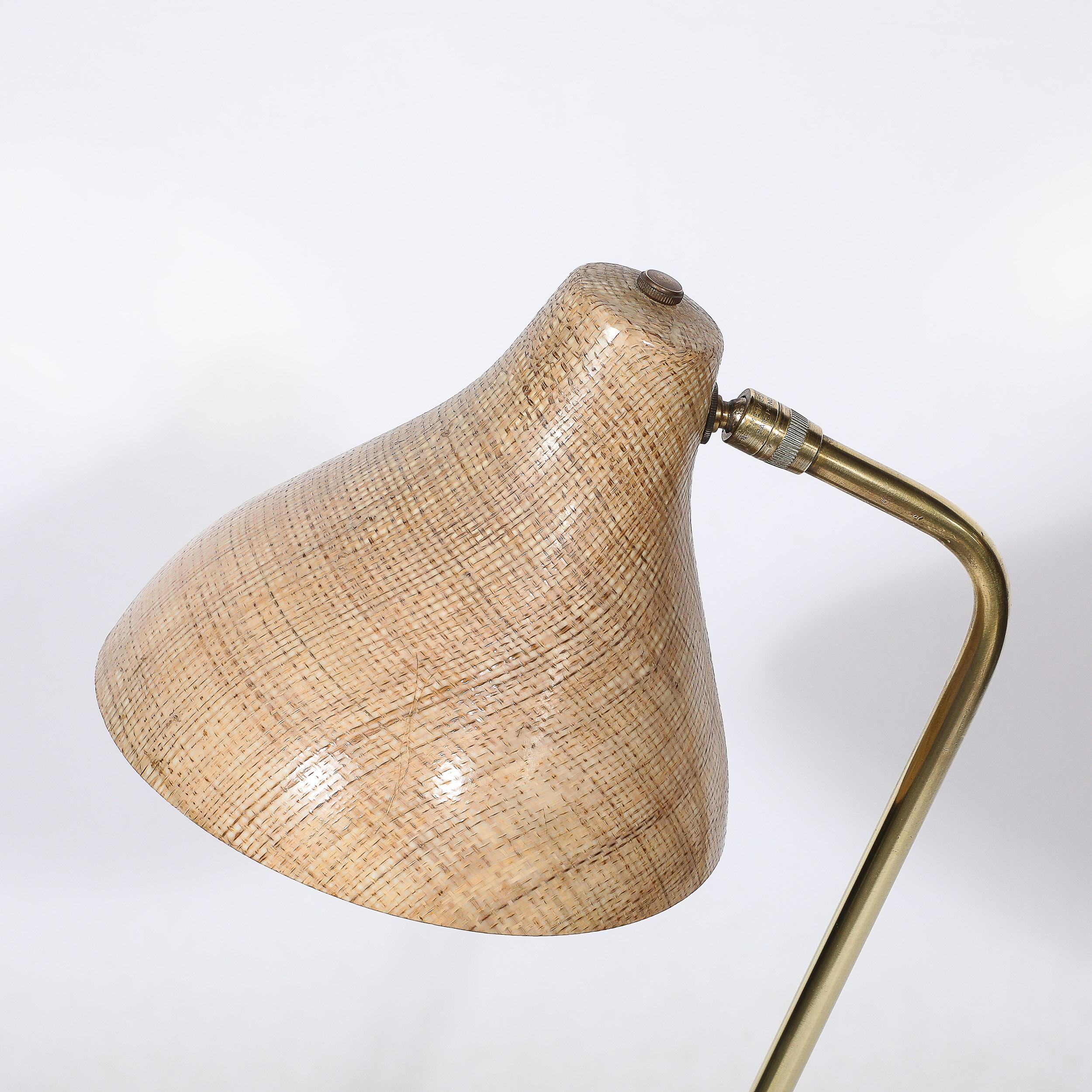This minimal yet materially captivating Mid-Century Modernist Articulating Table Lamp in Striated Resin Shade & Polished Brass Base originates from the Untied States, Circa 1950. Features a lovely organic shade in caste resin. One can view a variety