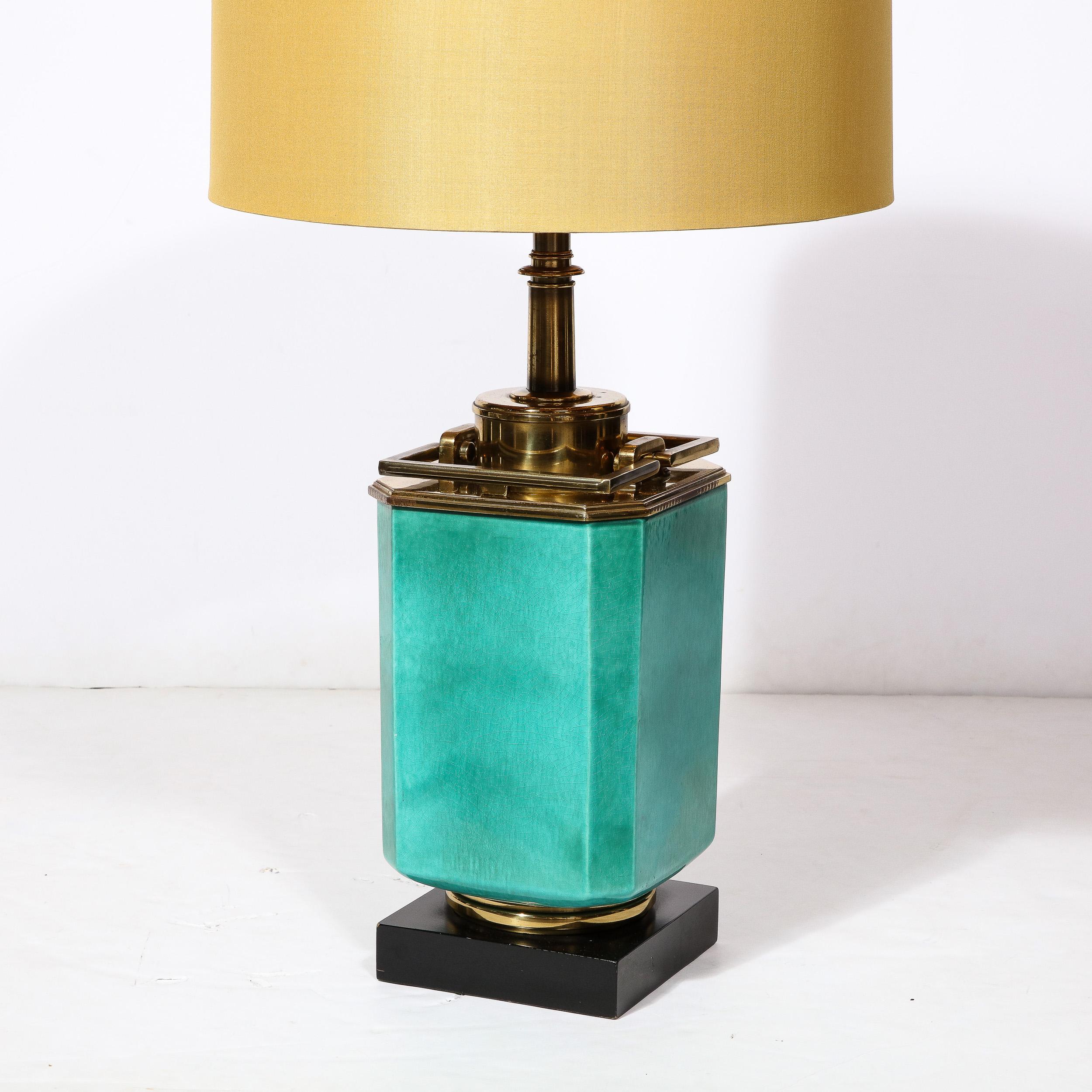 This beautifully bold single Jade Table Lamp originates from the United States during the 1950s Featuring a body in a lovely cool turquoise green with a bold rectangular profile, the top of the body beneath the shade is composed beautifully