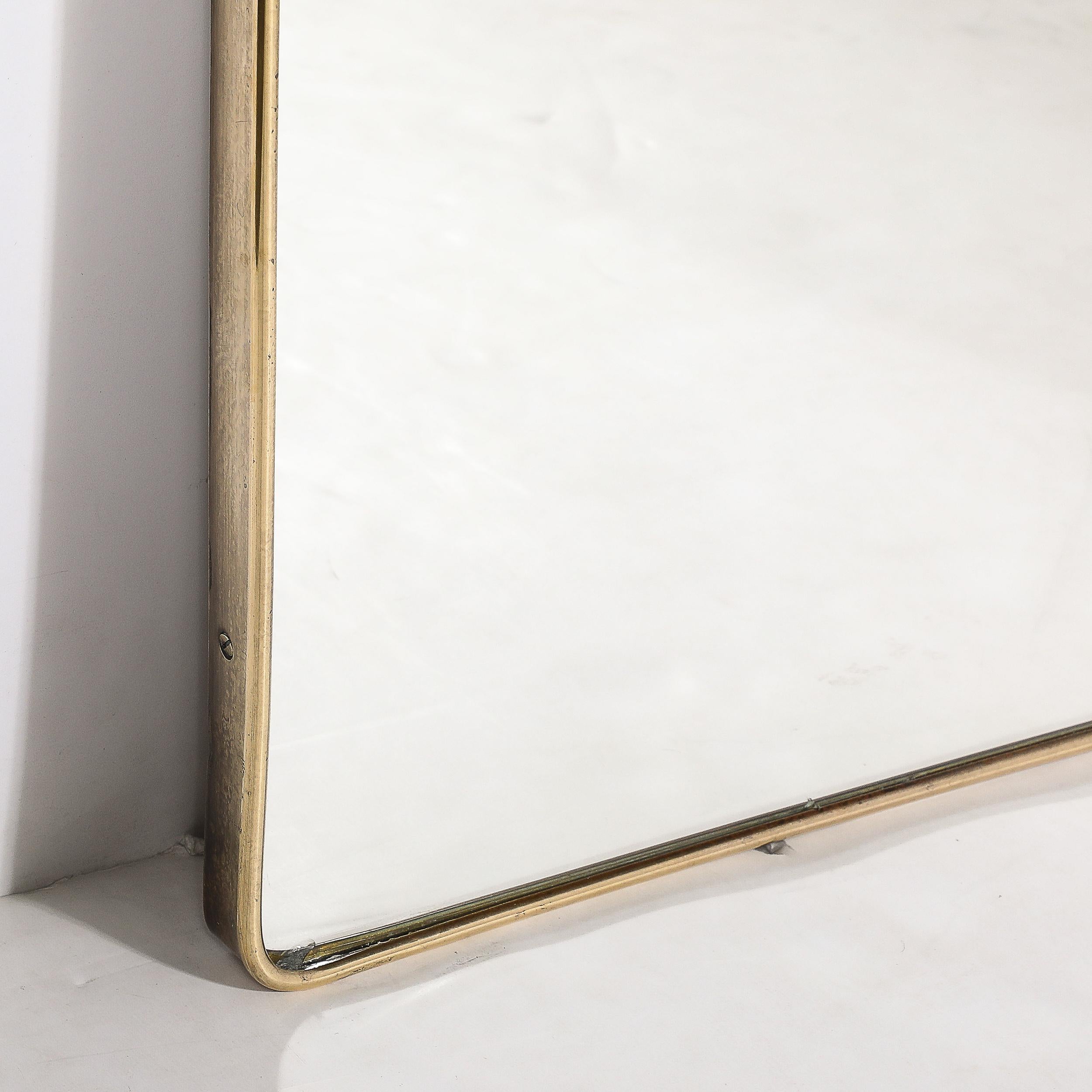Italian Mid-Century Modernist Tapered Brass Wrapped Mirror with Concave Top Detailing For Sale