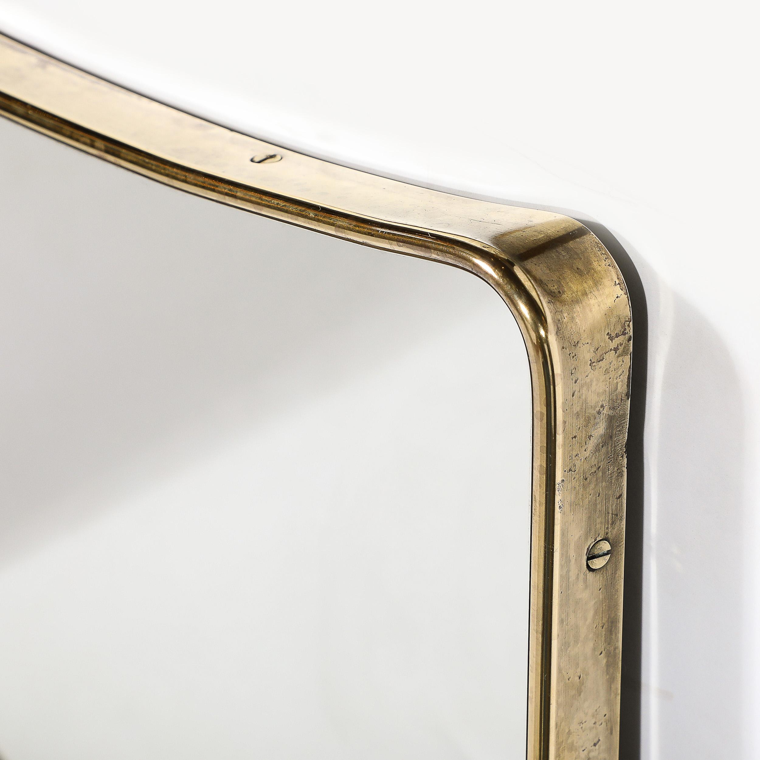 Mid-Century Modernist Tapered Brass Wrapped Mirror with Concave Top Detailing For Sale 1