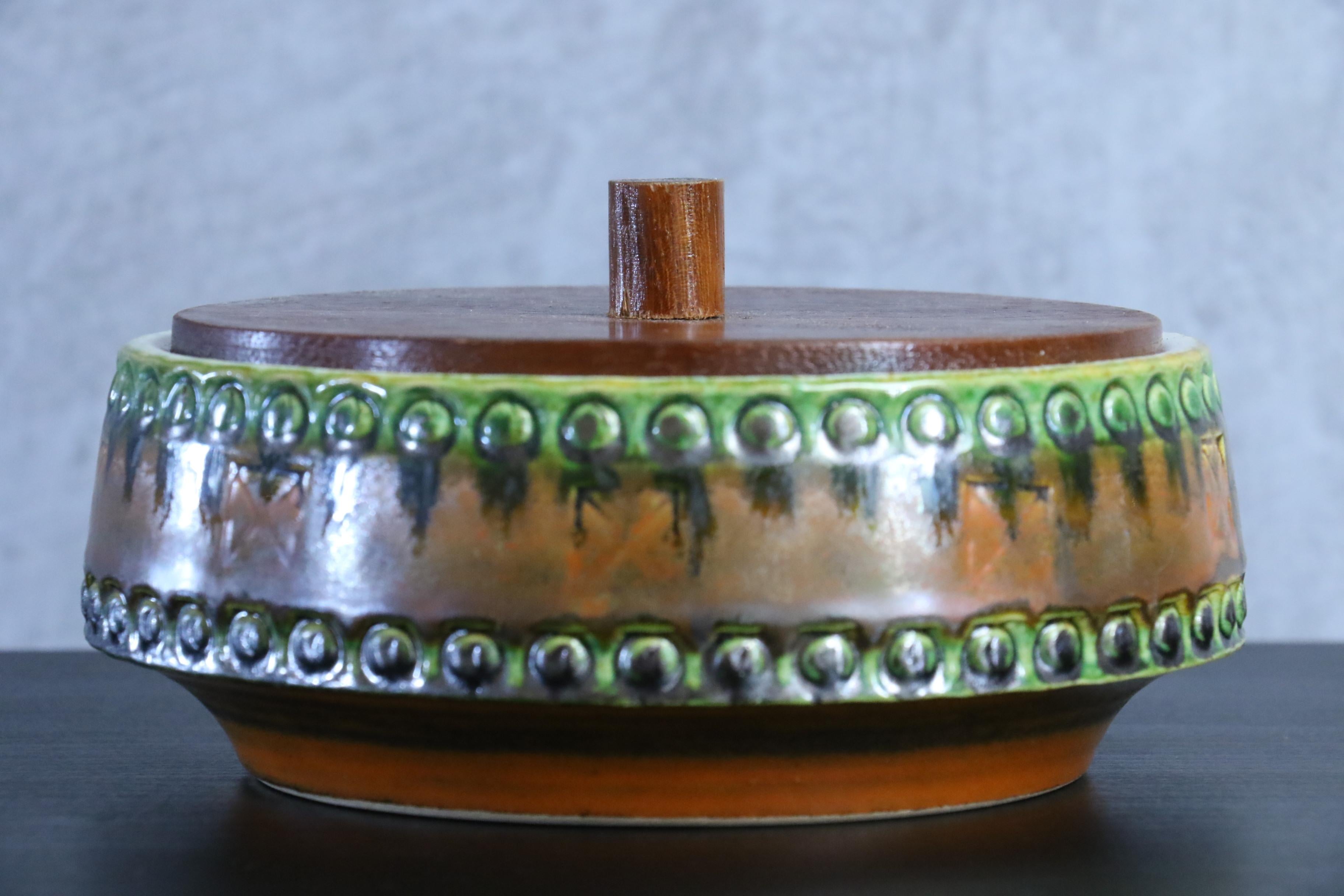 Mid-Century Modernist West Germany box by Scheurich Keramik, circa 1970

Beautiful and silky green and brown enamel with embossed relief pattern or motif. Classic 1970s Western Germany design.

On the last two pictures you can see other West