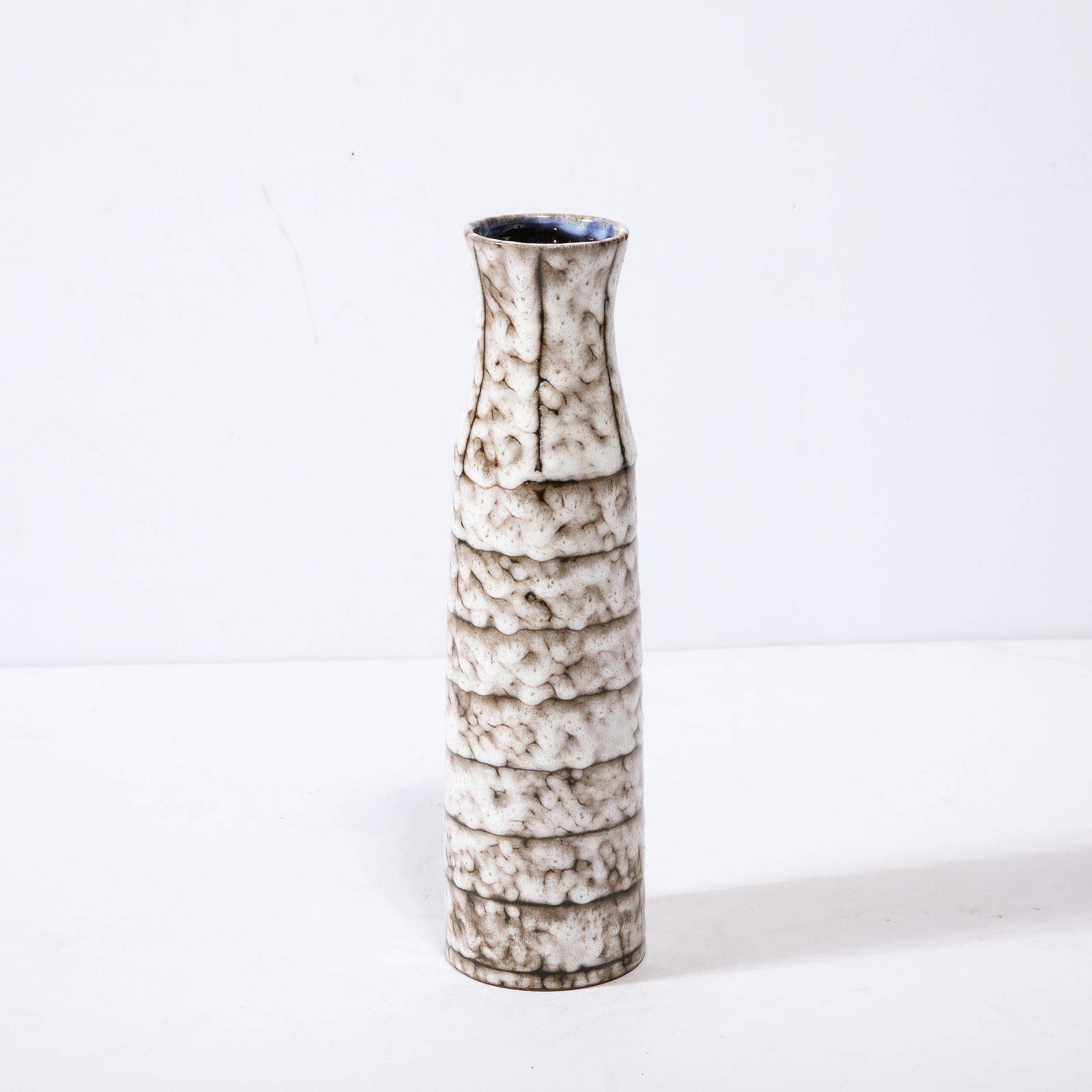 This Mid-Century Modernist ceramic vase with banded detailing is a beautiful example of Post War European Ceramics, realized in Hódmezovasarhely Majolikagyár, Hungary Circa 1960. With a Stunning textural finish composed in Cream White and Blackened