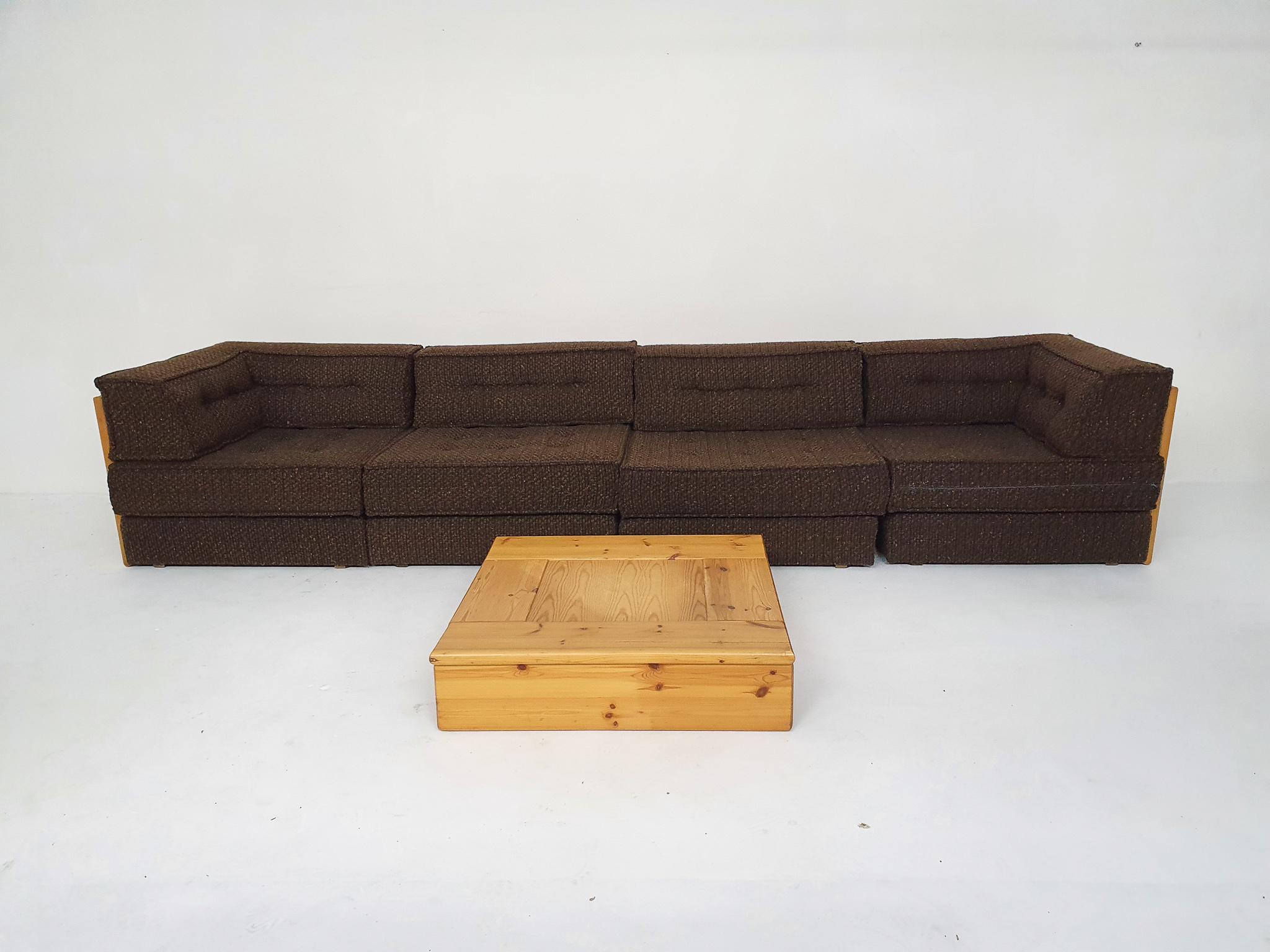 Pinewood sofa with the orignal brown wool upholstery. The set consist of:
2 corner elements (80 x 80 x 50cm LxWxH)
2 middle elements(80 x 80 x 50cm LxWxH)
1 coffee table (78 x 78 x 20cm LxWxH)
1 side table
All in good condition.