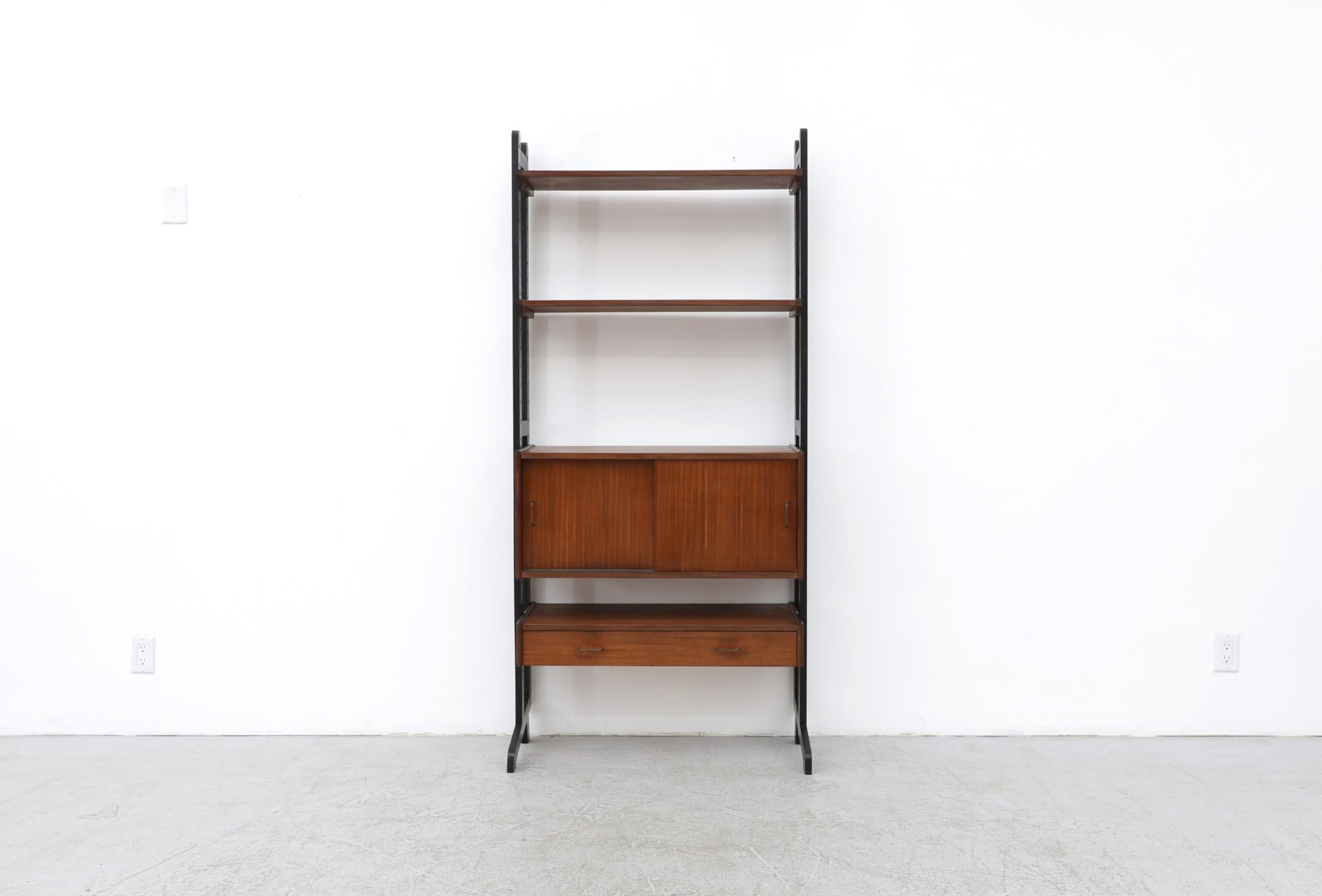 Cadovius Style Standing bookcase with a cabinet, 2 shelves and a small drawer. Simpla-Lux was a Dutch furniture company who produced self-assembly furniture items in the 60s and 70s. The height and placement of the shelving can be customized. In