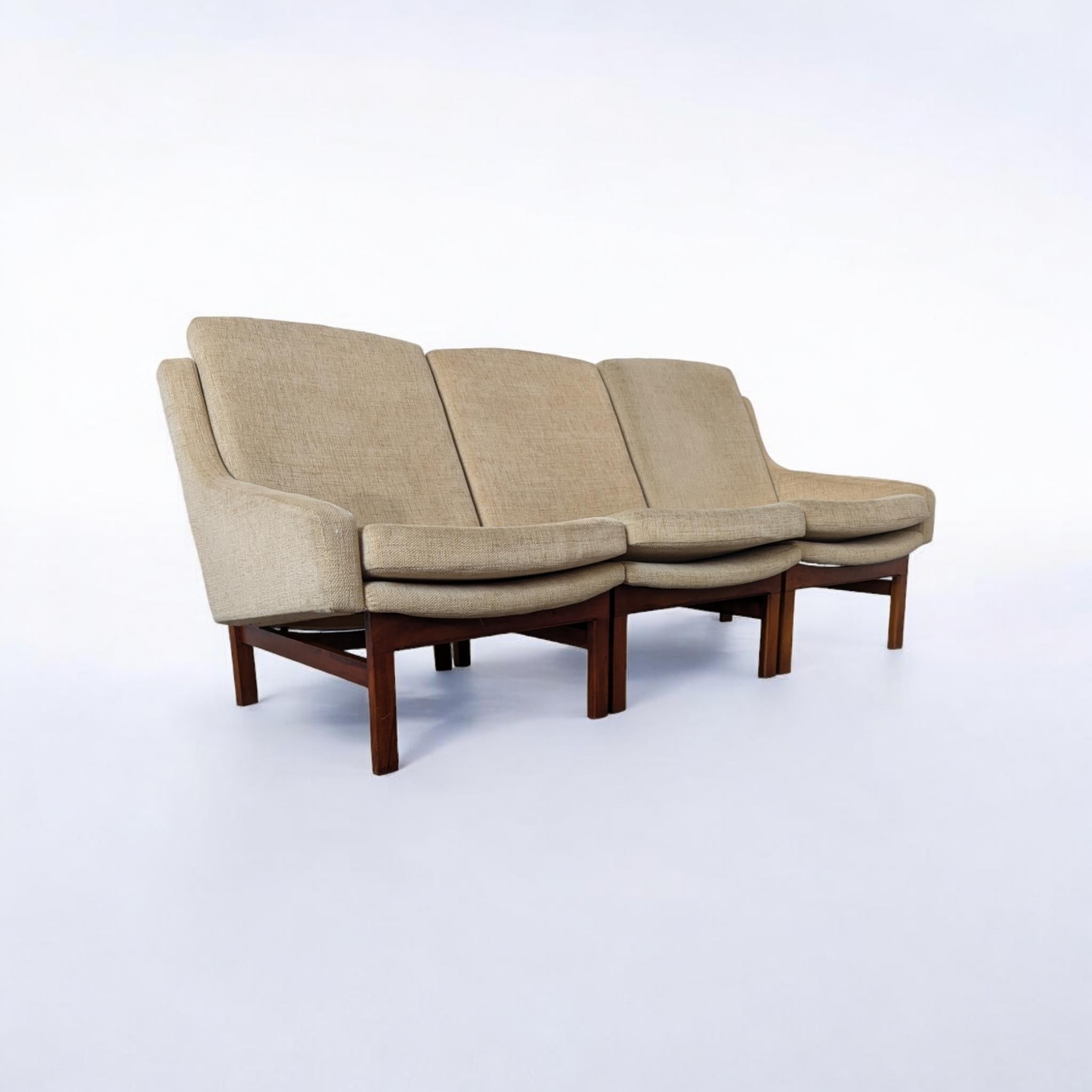 A beautiful modular set by Czech architect Karel Vyčítal, manufactured by Dřevotvar Jablonné nad Orlicí in former Czechoslovakia during the 1960s. The set consists of three pieces that can be arranged as a sofa or a loveseat and a chair, making it