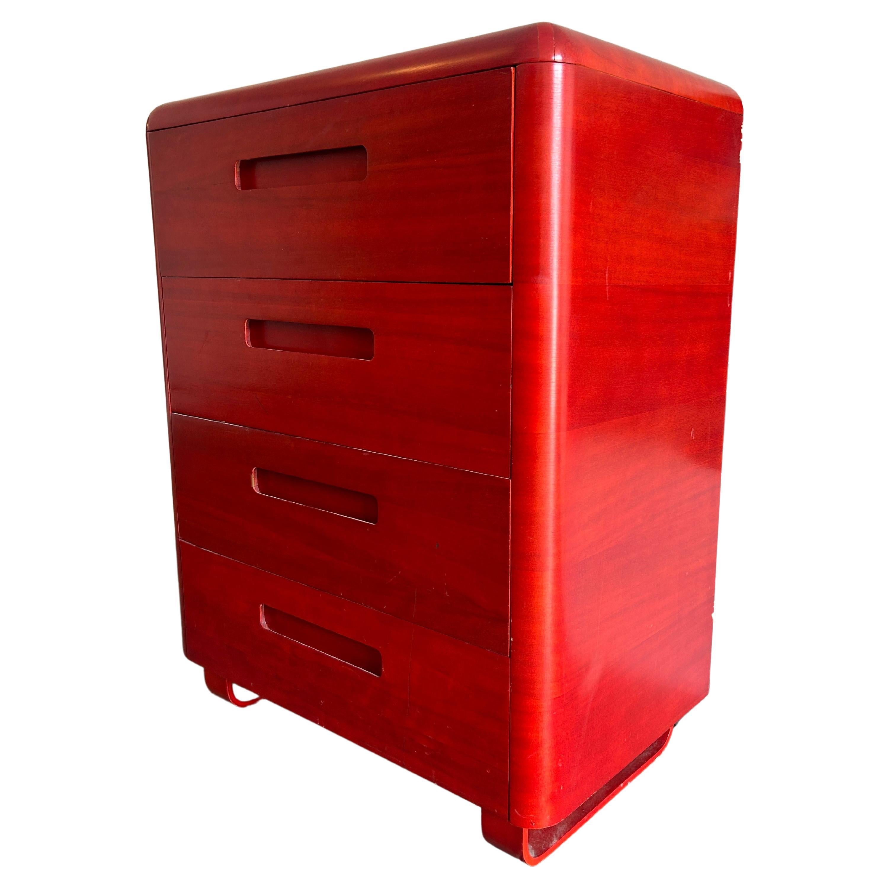 Mid century molded plywood tall 4 drawer tall dresser by Paul Goodman for plymold In red translucent Lacquer. Has rounded design with concave handles with bentwood curved drawers and legs. Good vintage condition. Located in Brooklyn NYC.

Measures