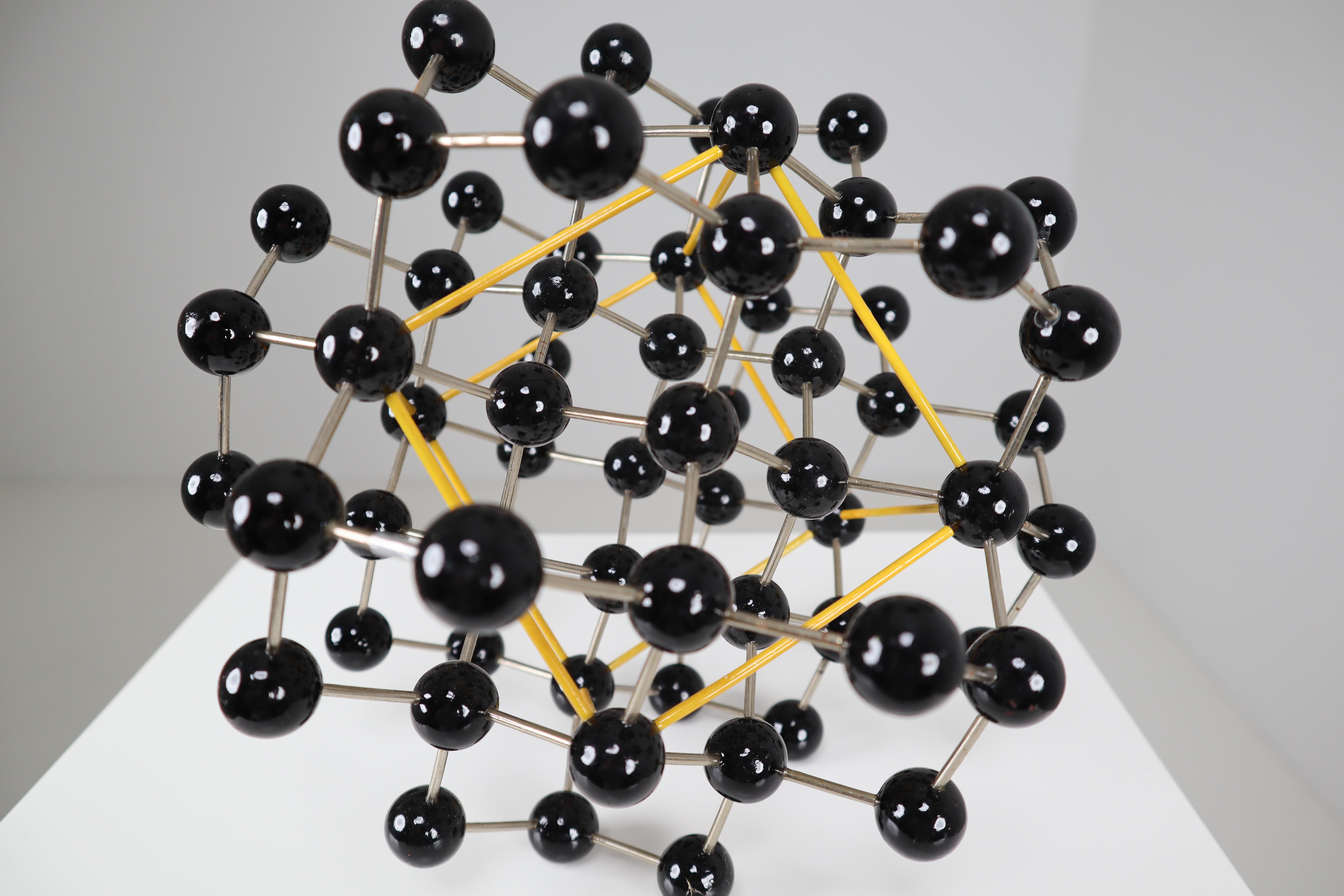 This beautiful patinated metal 1950s molecular structure will display great on any table for presentation. It measures very nicely at 9 x 8 x 9 Inch. The piece was used for study in a school in Prague back in the early or late 1950s. It still