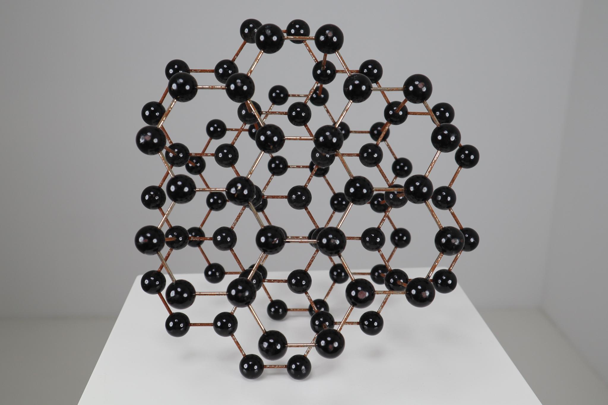 This beautiful patinated metal 1950s molecular structure will display great on any table for presentation. It measures very nicely at 12 x 8 x 11 Inch. The piece was used for study in a school in Prague back in the early or late 1950s. It still