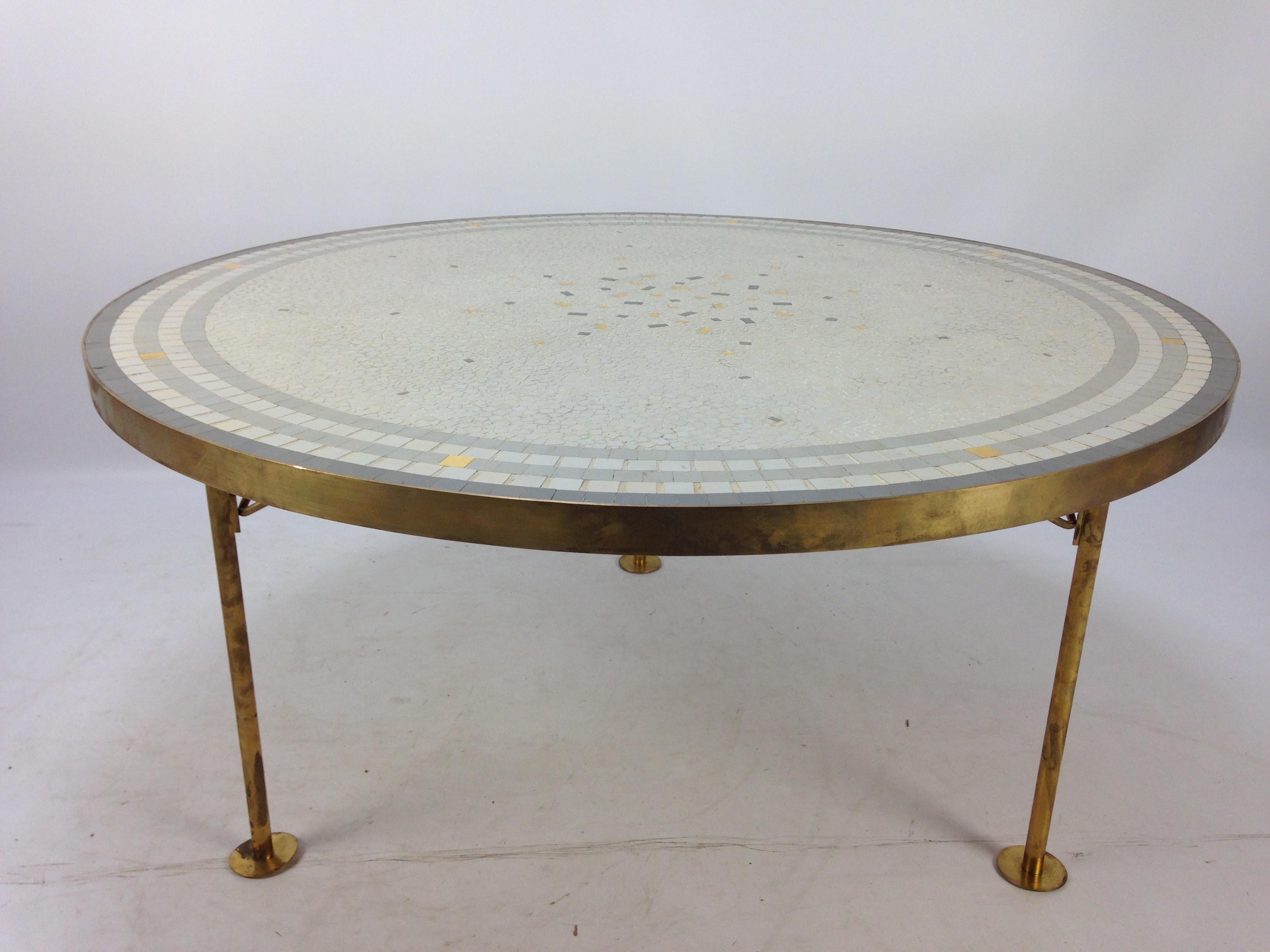 Beautiful round Mosaic top coffee table by Berthold Muller. 

Brass band around it on three legs. 

The top has a stunning composition and the brass has a lovely patina. 

Berthold Muller-Oerlinghausen (1893-1979) was a German sculptor who was