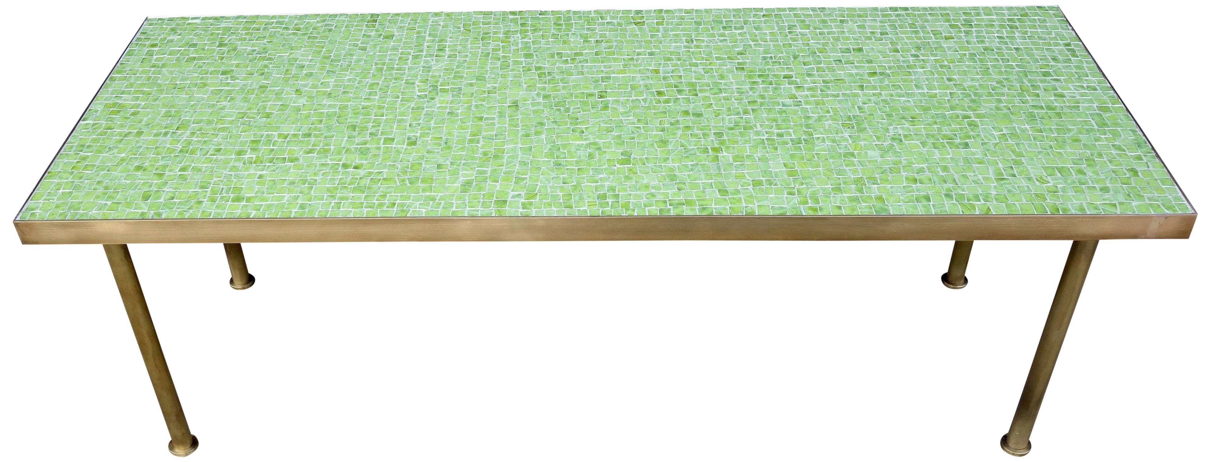 For your consideration is this beautiful smalt glass mosaic coffee table on a solid brass frame. Wonderful pistachio colored green mosaic tiles will highlight your space with a midcentury aesthetic that can match any decor.