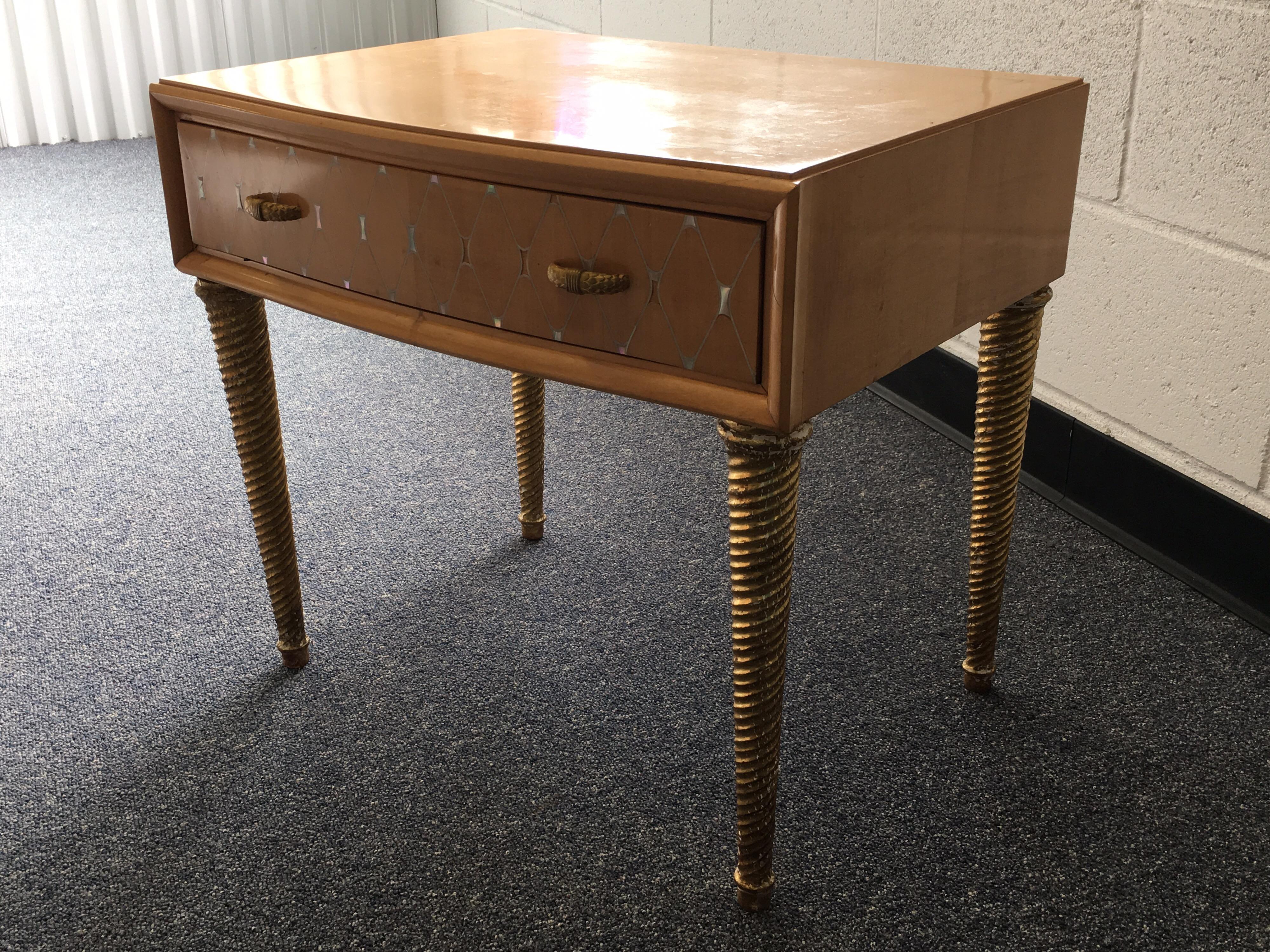 Midcentury mother of pearl and gilt bedside table. Inlay of mother of pearl in diamond pattern on the facing drawer with an inlay banding around the top. Beautiful bronze knobs. Gilded, twisted legs. Maker unknown.