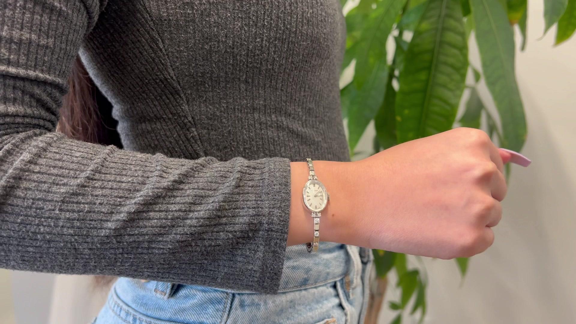 One Mid Century Movado Diamond 14k White Gold Wristwatch. Featuring 10 round brilliant cut diamonds with a total weight of approximately 0.30 carat, graded F color, VS clarity. Crafted in 14 karat white gold signed Movado, Switzerland with purity