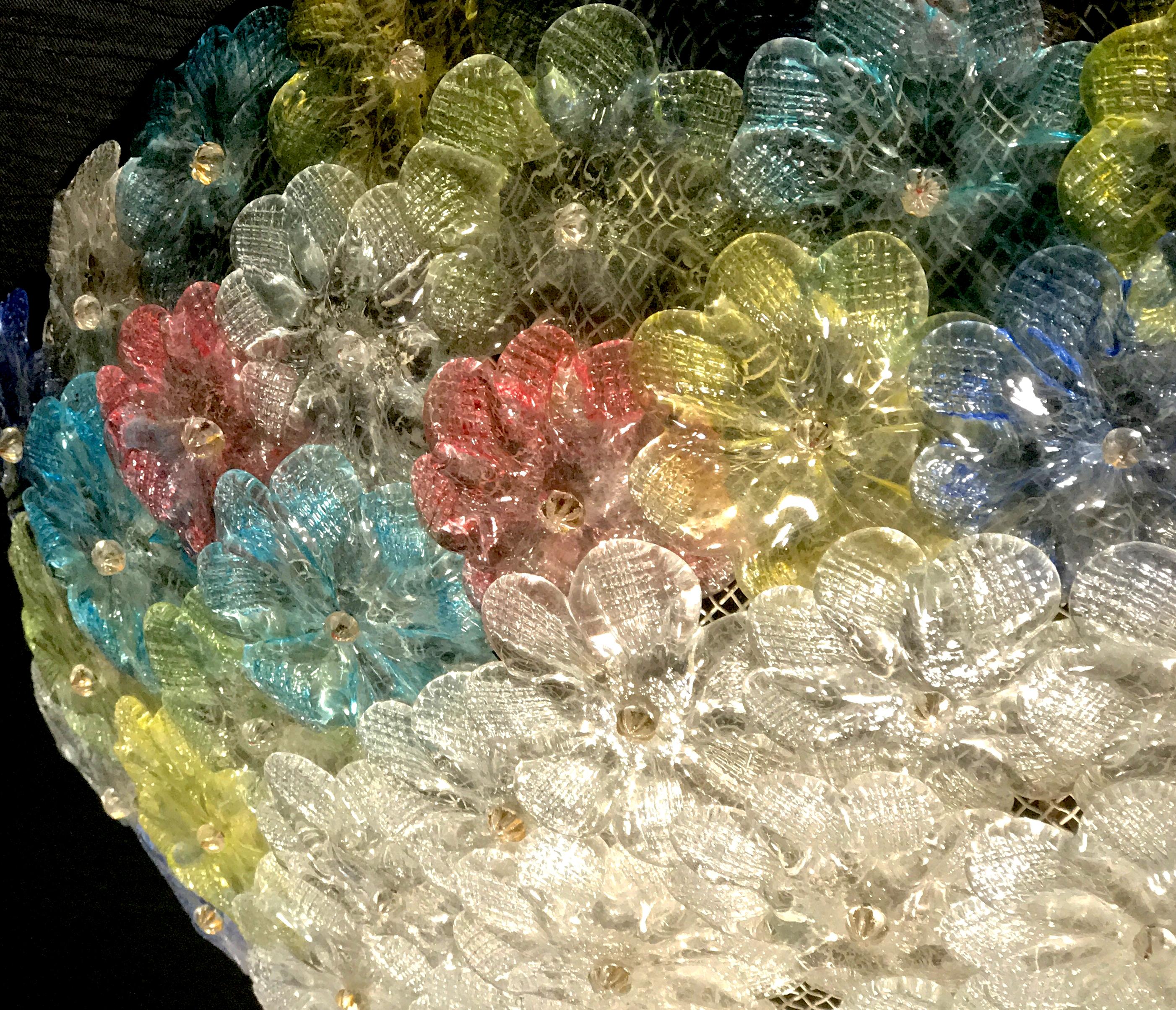 This amazing flower basket is made of dozen of precious Murano flowers glasses. Pink, yellow, blu, light blu and Ice color handblown flowers.
Available a pair and also a pair of extraordinary sconces.
Four E 14 light bulbs with 4 Watt lights.
 