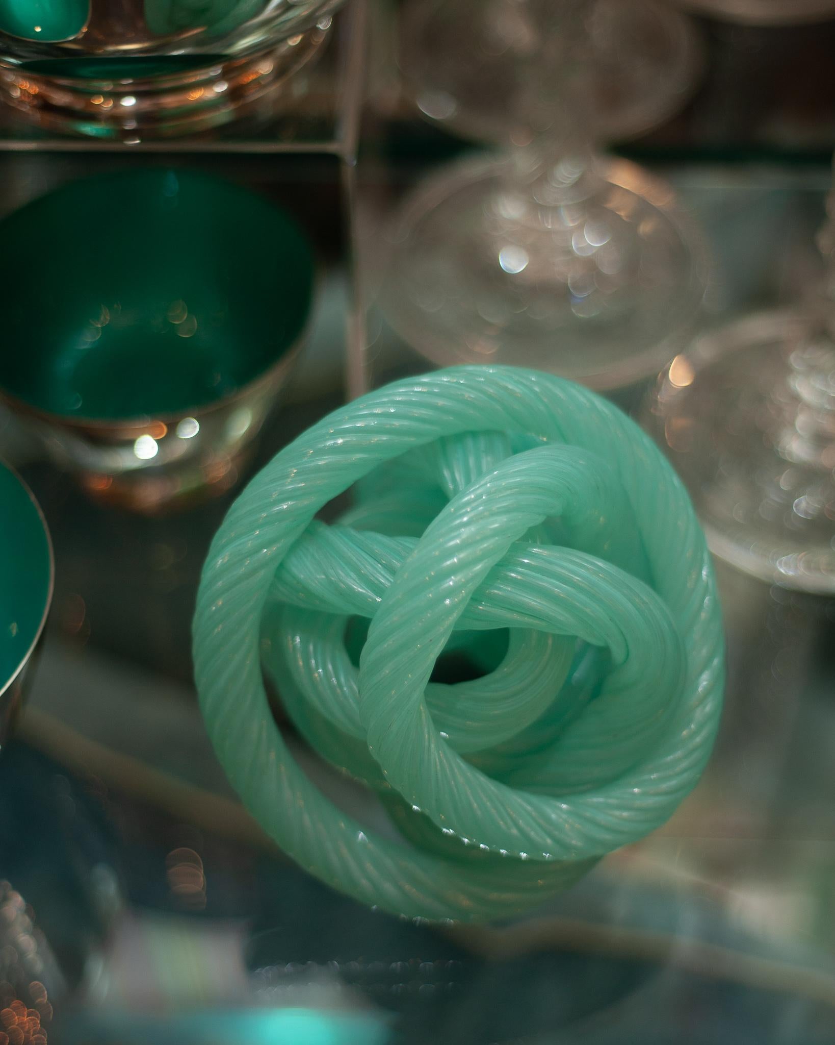 A stunning and decorative sculptural midcentury Murano blue green glass cane rope sculpture.
