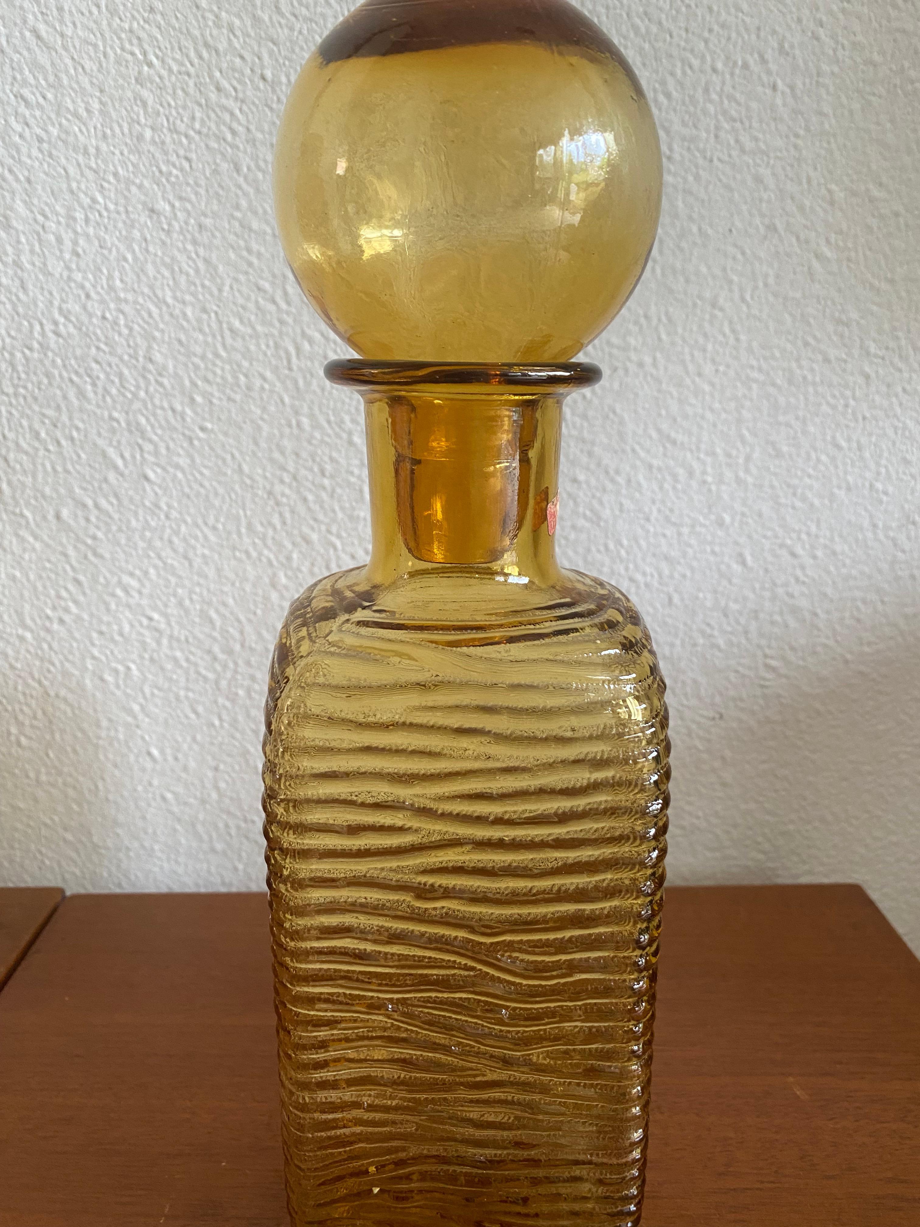 In a perfect condition beautiful colored carafe with original label.