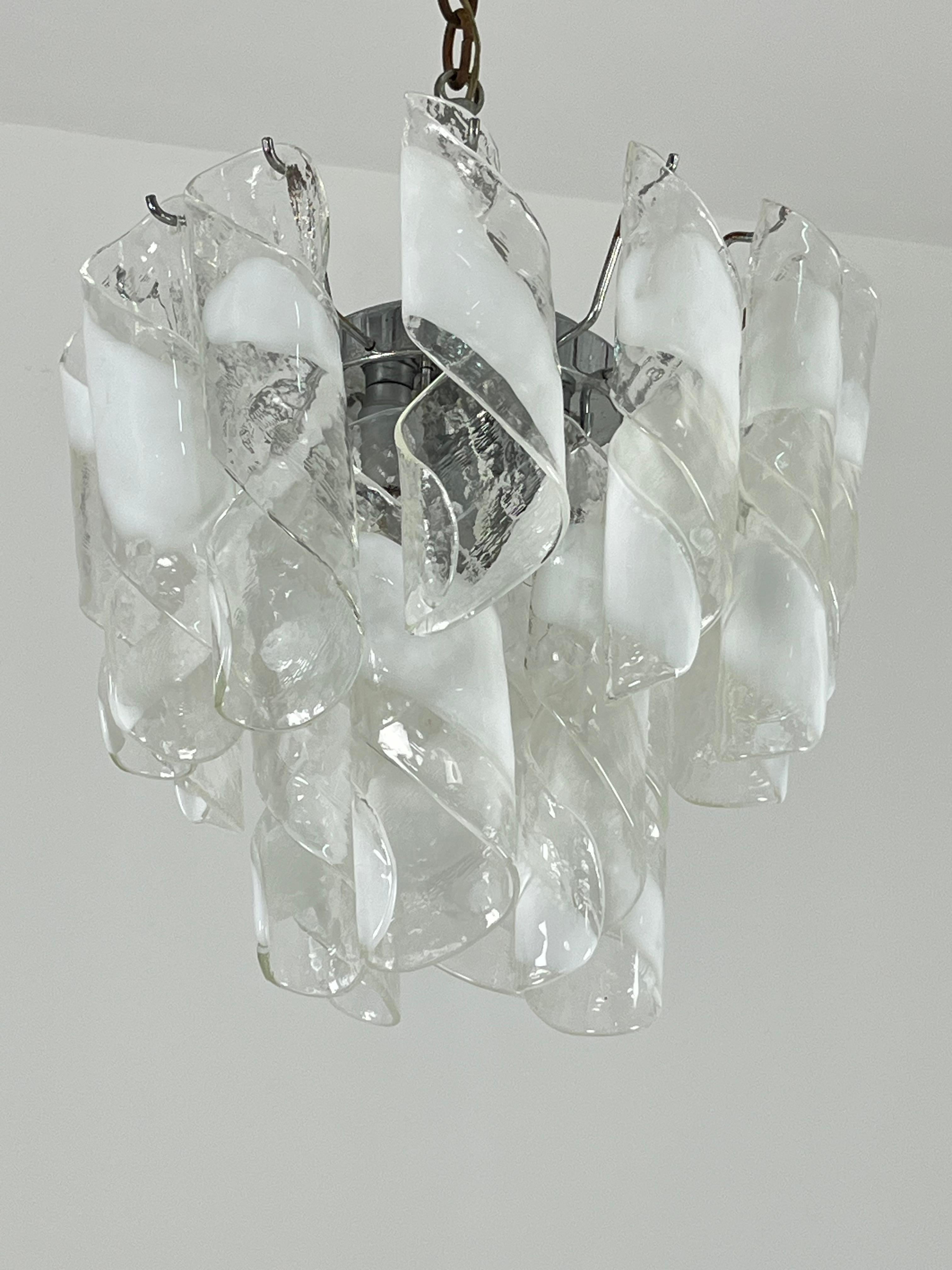 Mid-century Murano glass 4-light chandelier, 1960s
Metal structure-
e14 lamps.
Intact glasses.
Good condition.
Special object with Made in Italy design.

We guarantee immediate shipping with adequate packaging and trusted courier.
