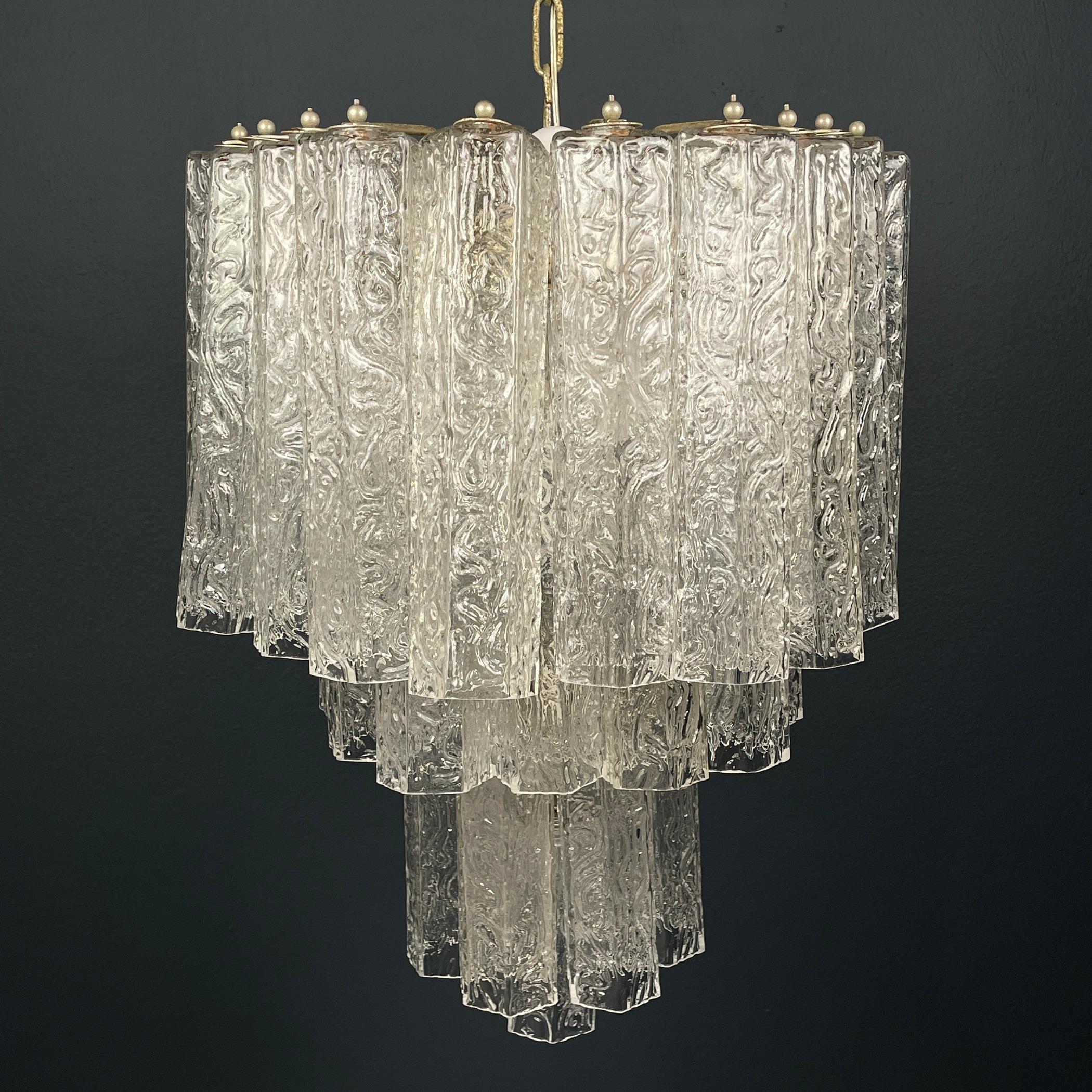 The elegant Murano glass chandelier made in Italy in the 60s. Design Venini & Co. Venini & Co. played a leading role in the revival of Italy’s high-end glass industry, pairing innovative modernist designers with the skilled artisans in the