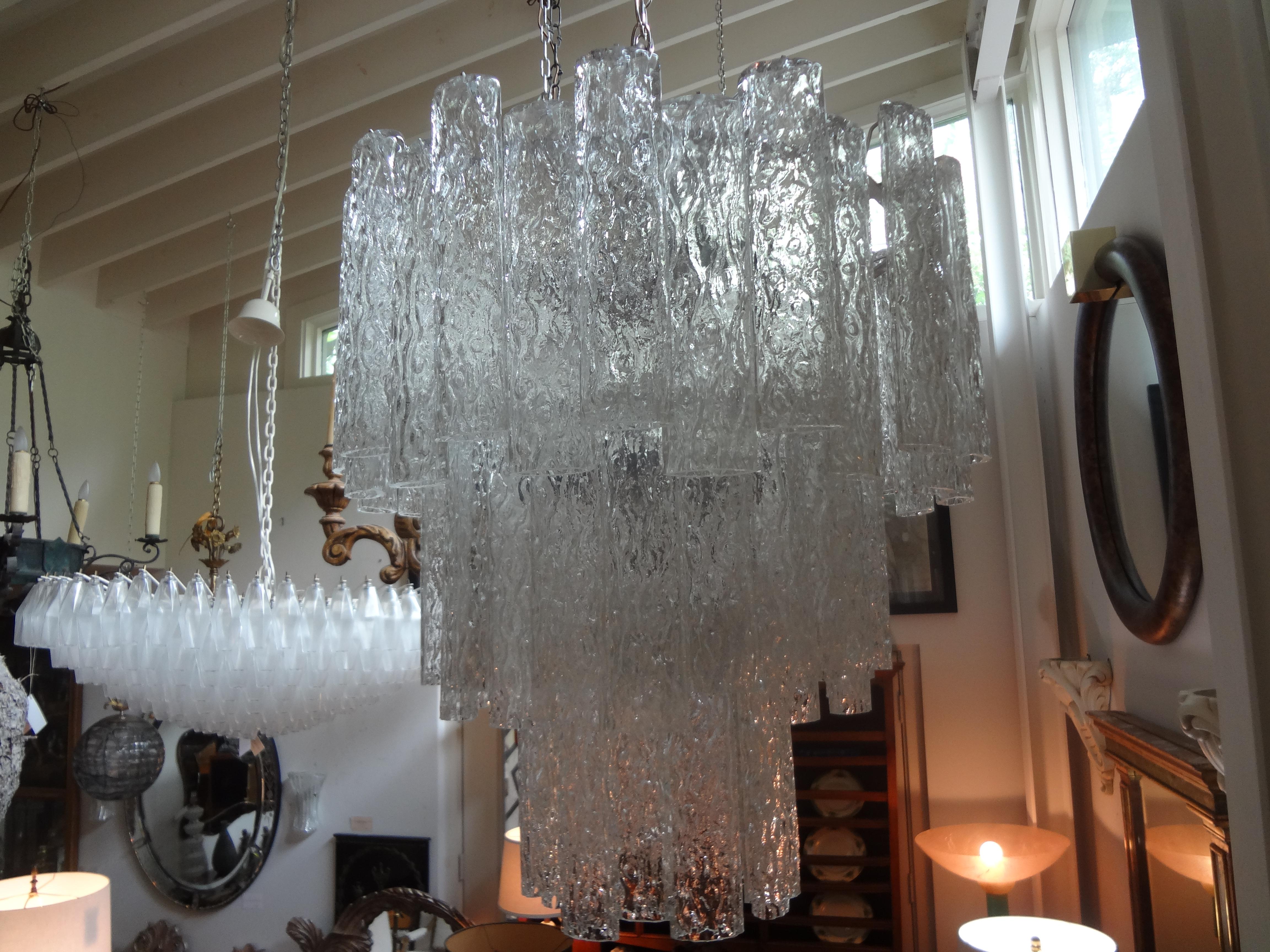 Midcentury Venin style Murano chandelier.
Unusual Italian midcentury Murano glass chandelier inspired by Venin. This vintage Murano glass chandelier is comprised of unusual oval shaped textured blown glass tubes suspended from a chrome frame. This