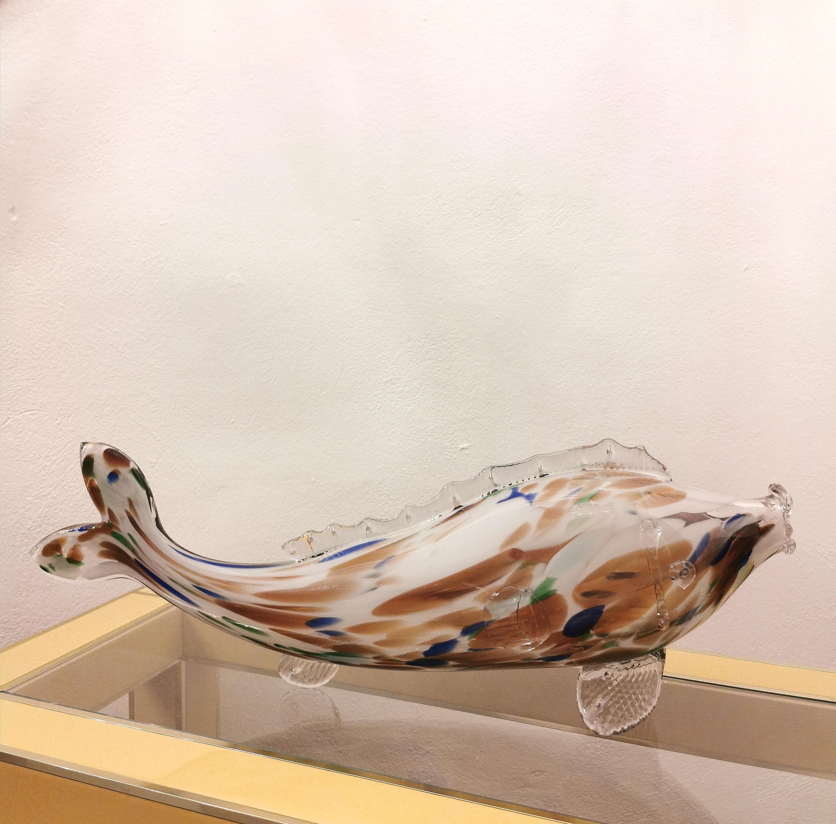 Multicolored hand-blown artistic Murano glass sculpture depicting a fish. This piece is perfect to be placed inside your home or office. Made in Italy in the 70s.
