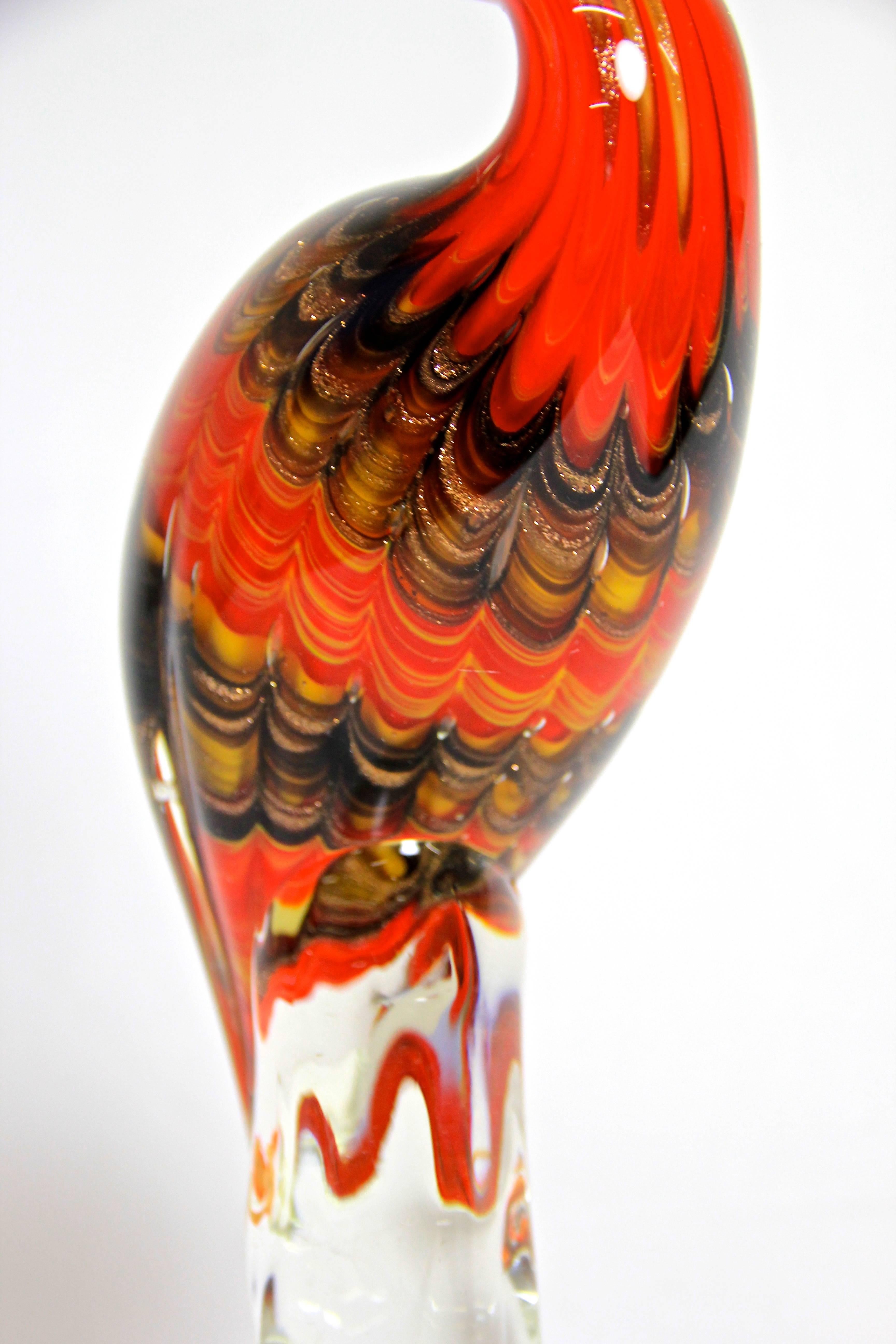 Beautiful large midcentury Murano glass Flamingo from the 1950s out of the famous workshops in Italy. A rare Murano glass masterpiece and absolute eyecatcher from its head to its toe. A lovely design with many details artfully colored in red, yellow