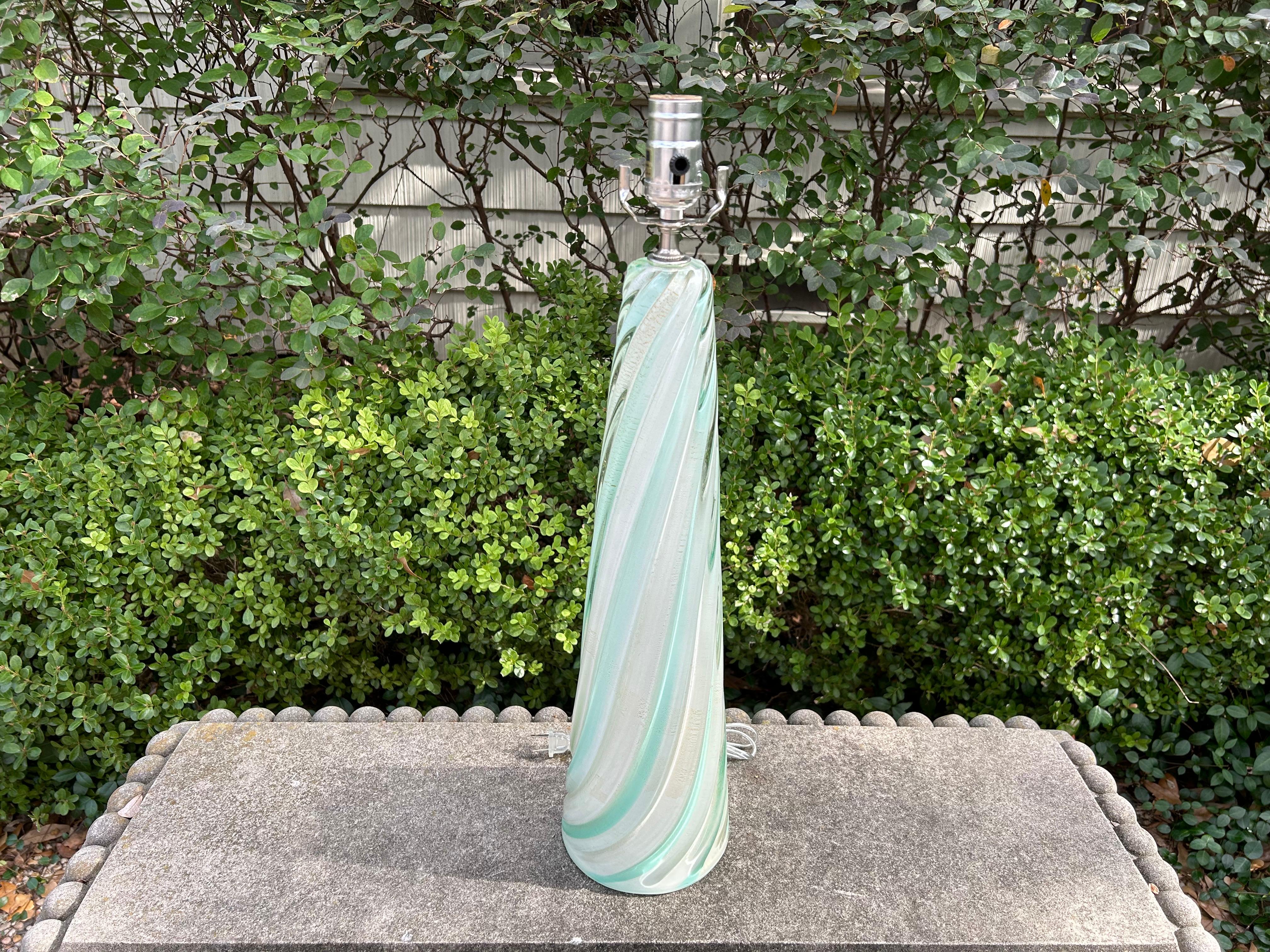 Mid Century Murano Glass Lamp By Seguso
Offered is a stunning Murano glass lamp made by Seguso, the prestigious Murano glass design house based on the island of Murano.
This lovely Hollywood Regency Murano glass lamp with an alternating soft blue
