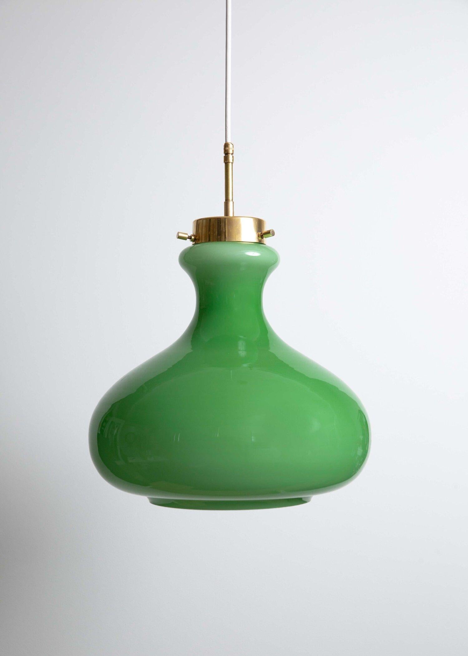 Exceptional large Murano glass pendant manufactured by Vistosi in the early 1960’s. Brass fittings compliment the clean lines. New brass canopy and 121 inches (307 cm) of round white cord included. Brass fittings compliment the clean lines.