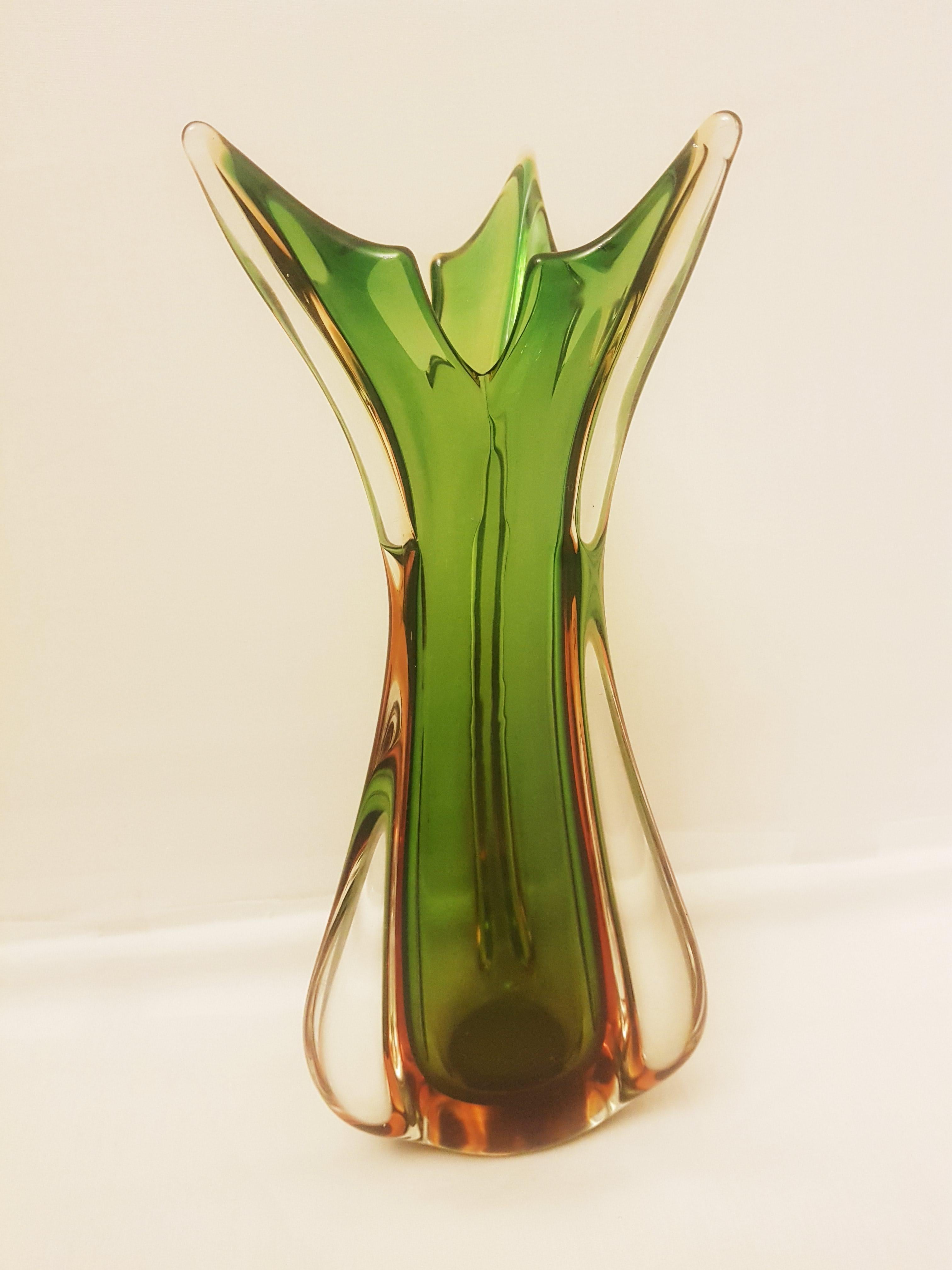 Beautiful mid-century Murano glass sommerso set in organic amber, green and clear, attributed to Flavio Poli for Seguso; years 1950-1960. Set of four vases, one perfume bottle and one large bowl. The vases are 20cm, 26cm, 27cm and 27cm tall,