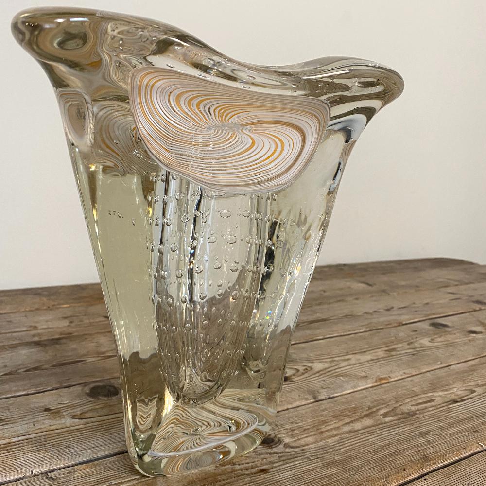 Mid-century Murano glass vase in the manner of Ercole Barovier is a masterpiece of the glass blower's art! Visually intriguing spiral milk glass pieces were surrounded by the naturalistic form of the vase in heavy glass infused with air bubbles in a