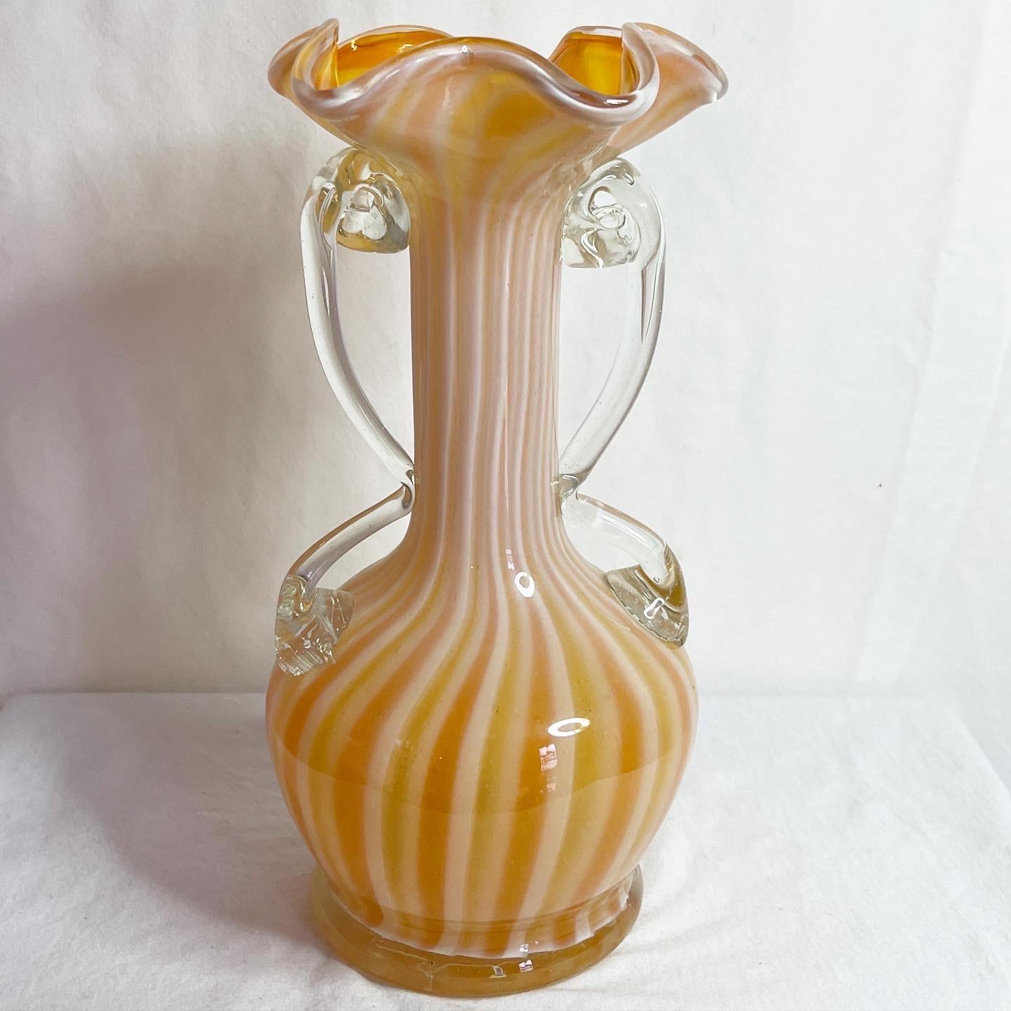 Incredible Murano glass striped vase. Features a fantastic orange and white colors.
   