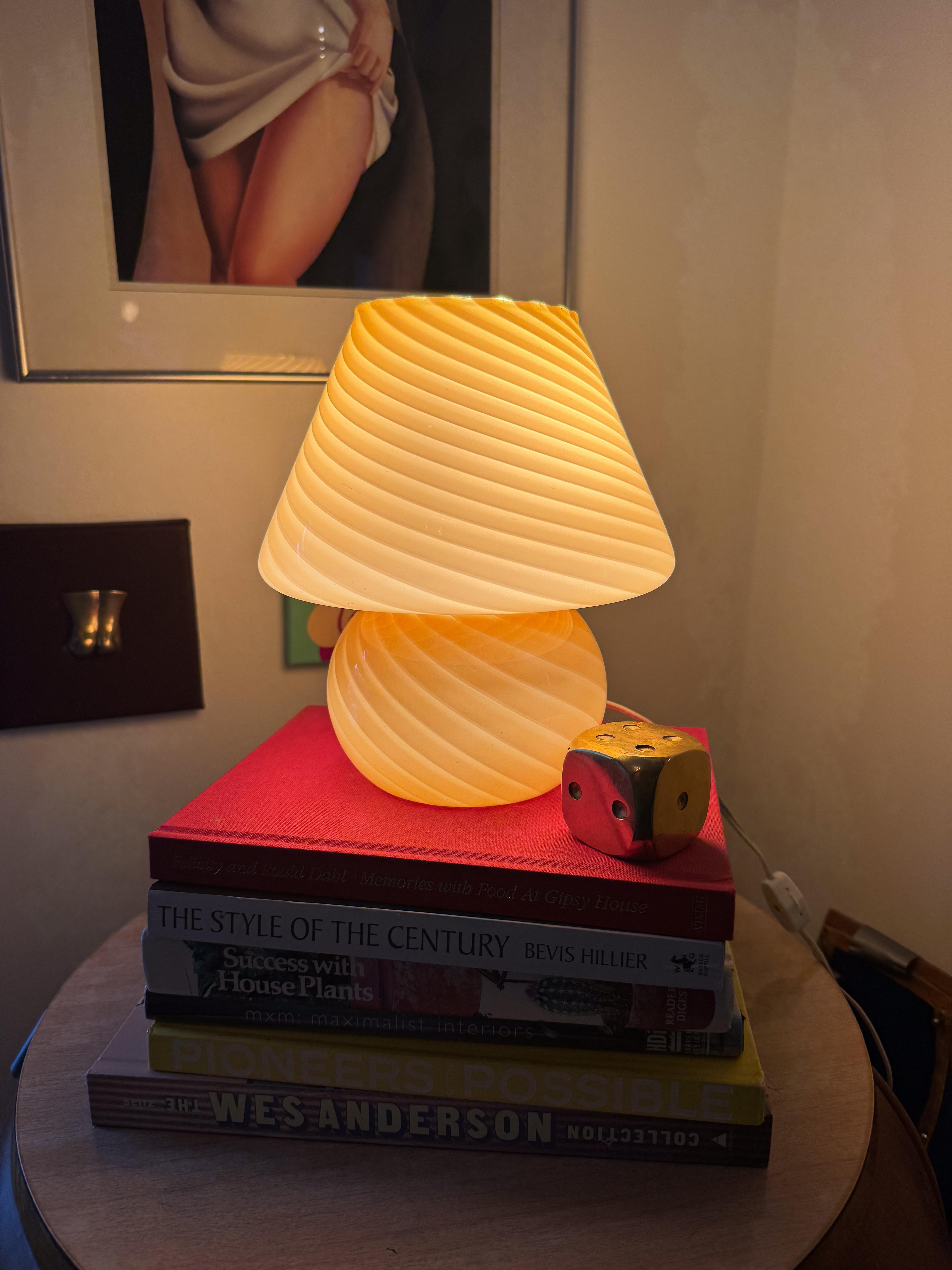 A stunning vintage Murano glass mushroom lamp in a rare honey caramel brown hue, crafted using the signature swirl technique. The warm gradient effect gives the glass an ombré-like depth, enhancing its rich, inviting glow when