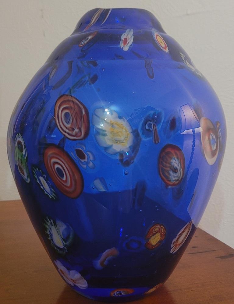 Presenting a beautiful mid century Murano Millefiori style Art glass vase.

Made in Murano, Italy in the 1960’s.

Unsigned, but undoubtedly hand blown and hand made and decorated in Murano.

Chunky vase with cobalt blue art glass and