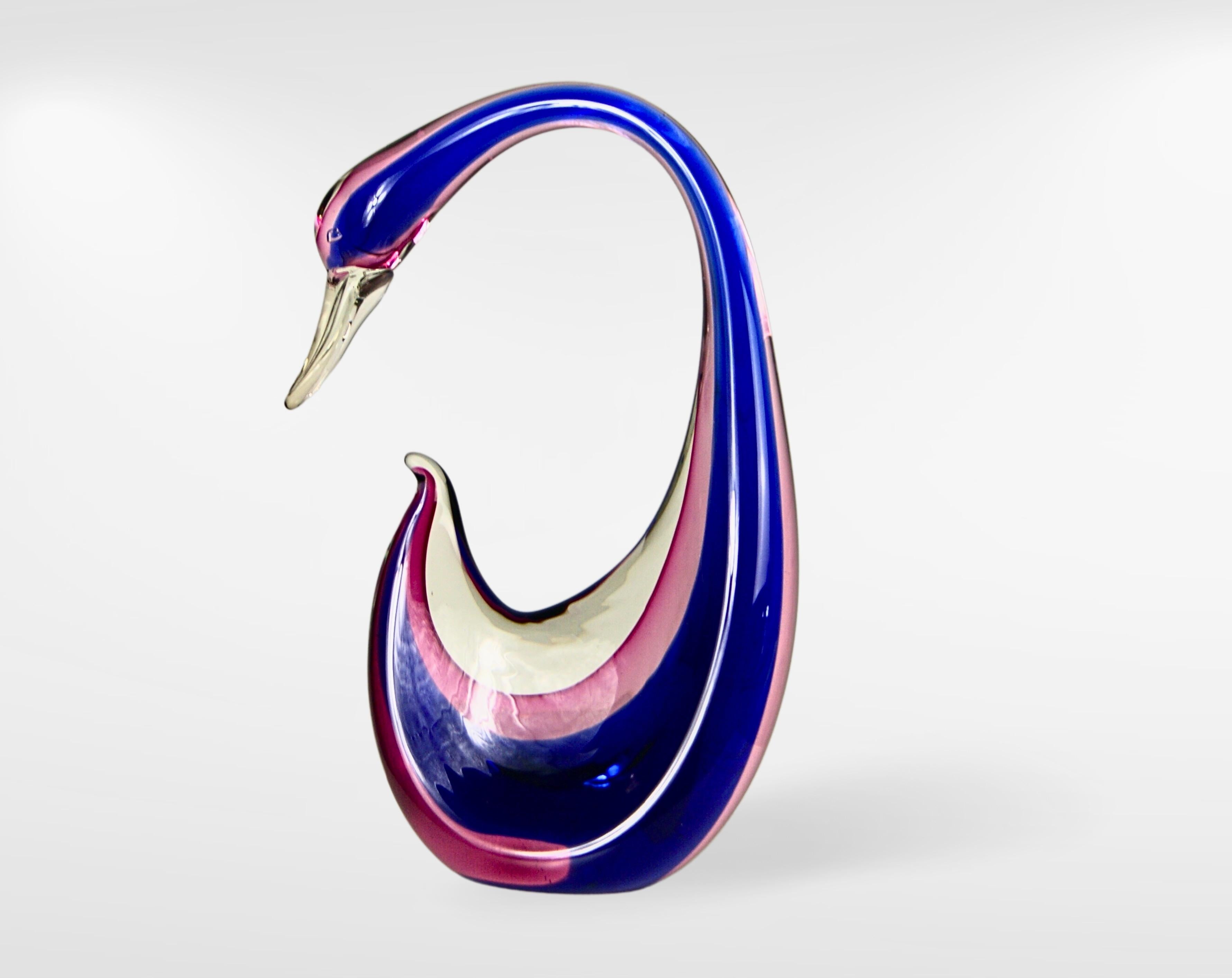 Midcentury Murano Sommerso Glass Large Swan Sculpture.
Attributed to Flavio Poli for Seguso.
Gorgeous Swan with elegant crested long neck.
Submerged glass sculpture, intricately layered in striking gradient shades of purple and pink.
Large and