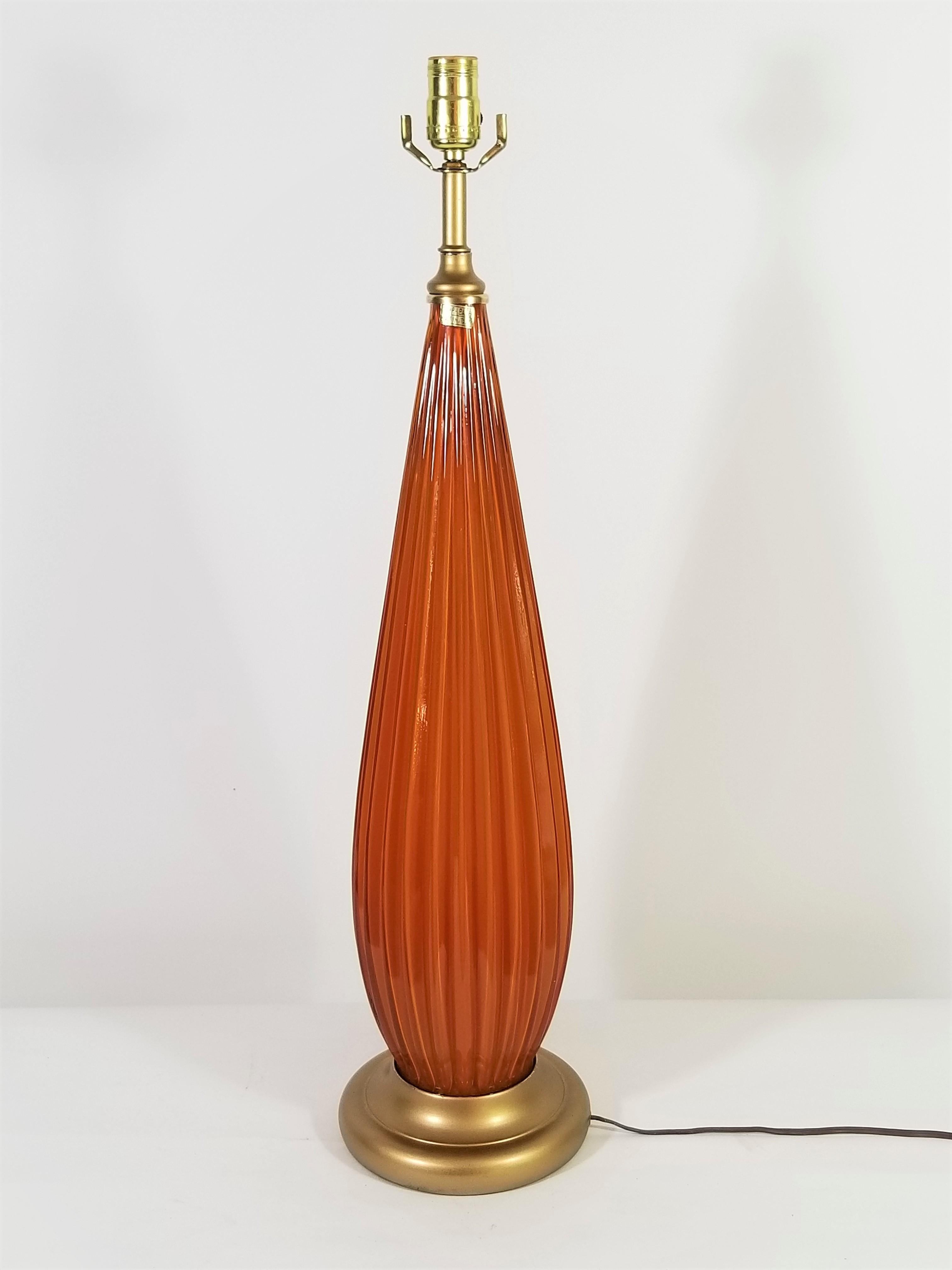 Stunning midcentury 1950s-1960s tall Italian Murano art glass table lamp. Made in Italy. Gorgeous color of burnt orange or pumpkin art glass. Still retains original 