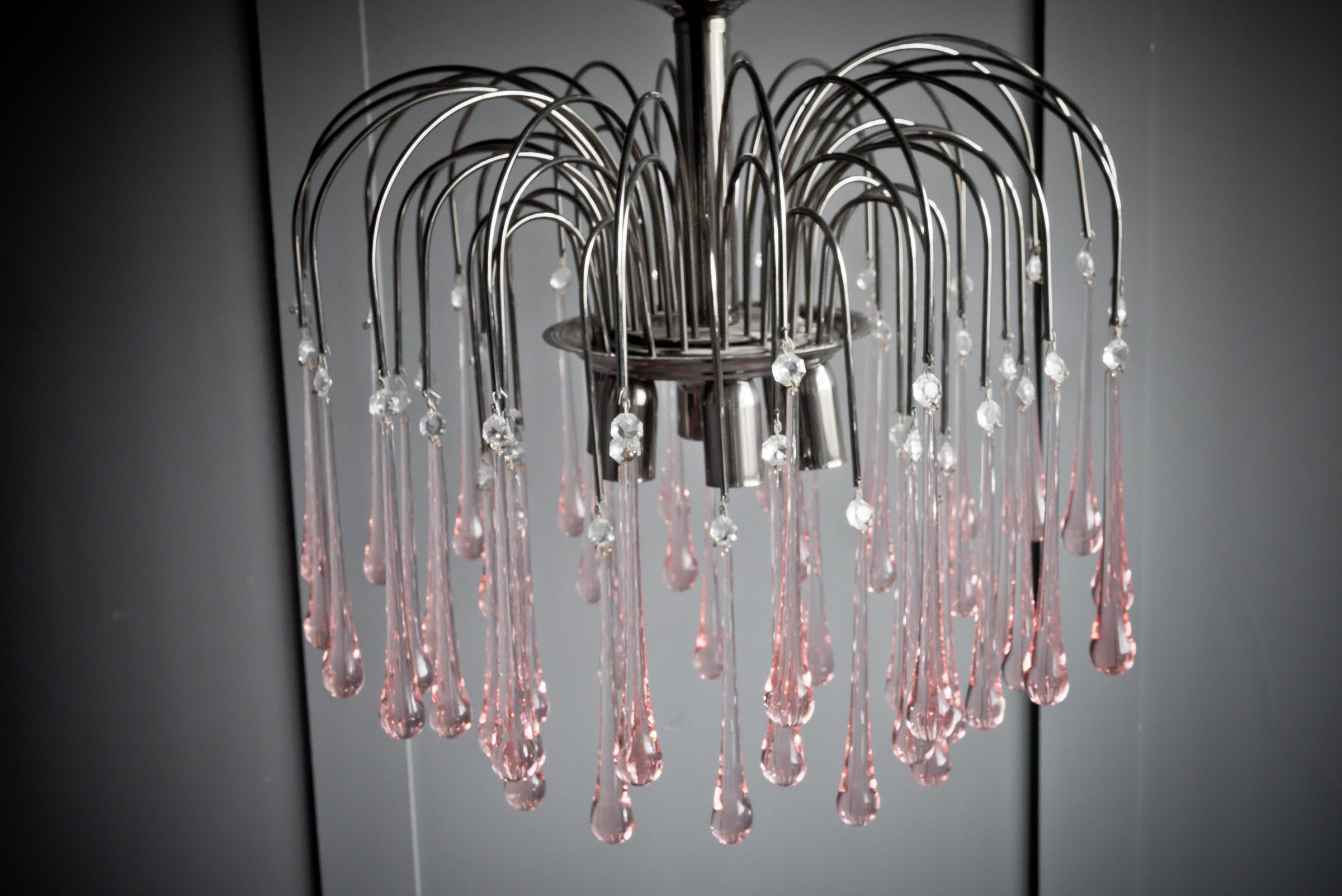 Beautiful Mid century murano glass chandlier with elegant pink tear drops coming off a chrome base.