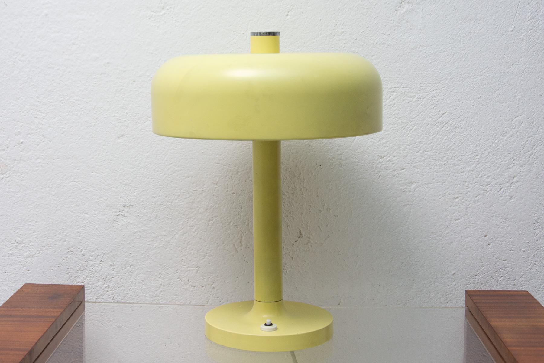 This mid-century table lamp was made in the former Czechoslovakia in the 1960s.
It is made of sheet metal and plastic.

In good original condition, shows signs of age and using.

Works with two E27 bulbs, UP to 250 V.

Supplied without