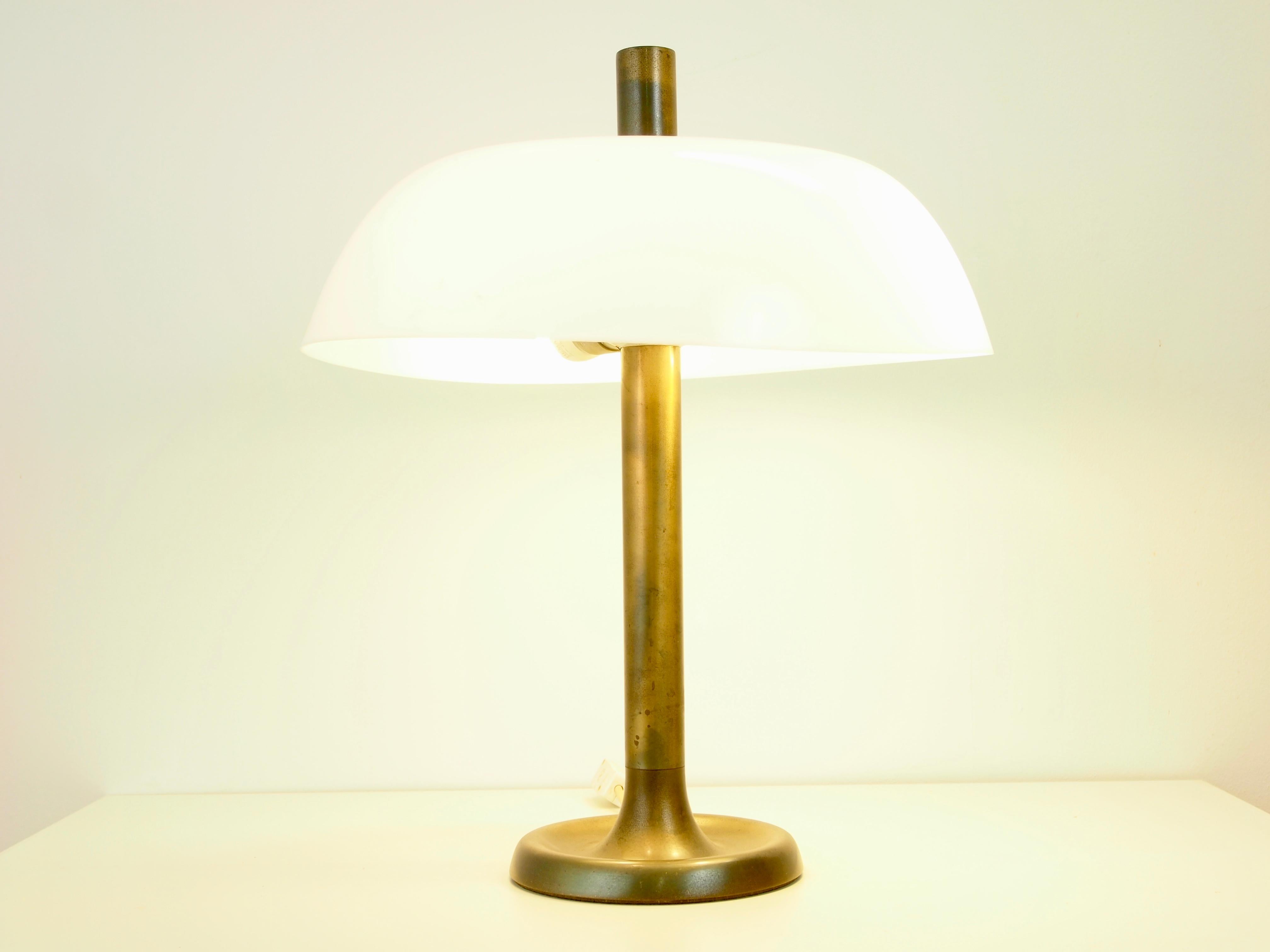 Amazing vintage midcentury German table or desk lamp produced by Hillebrand with a patinated brass 