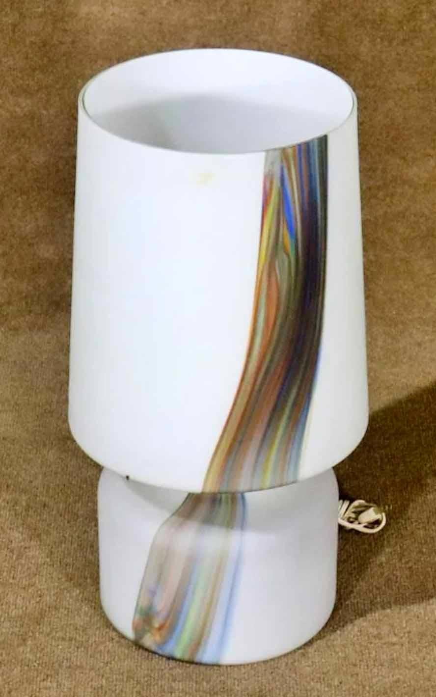 Mid-Century Modern glass lamp in frosted white with a colorful painted line. Top and bottom light up together or separately. 
Please confirm location.