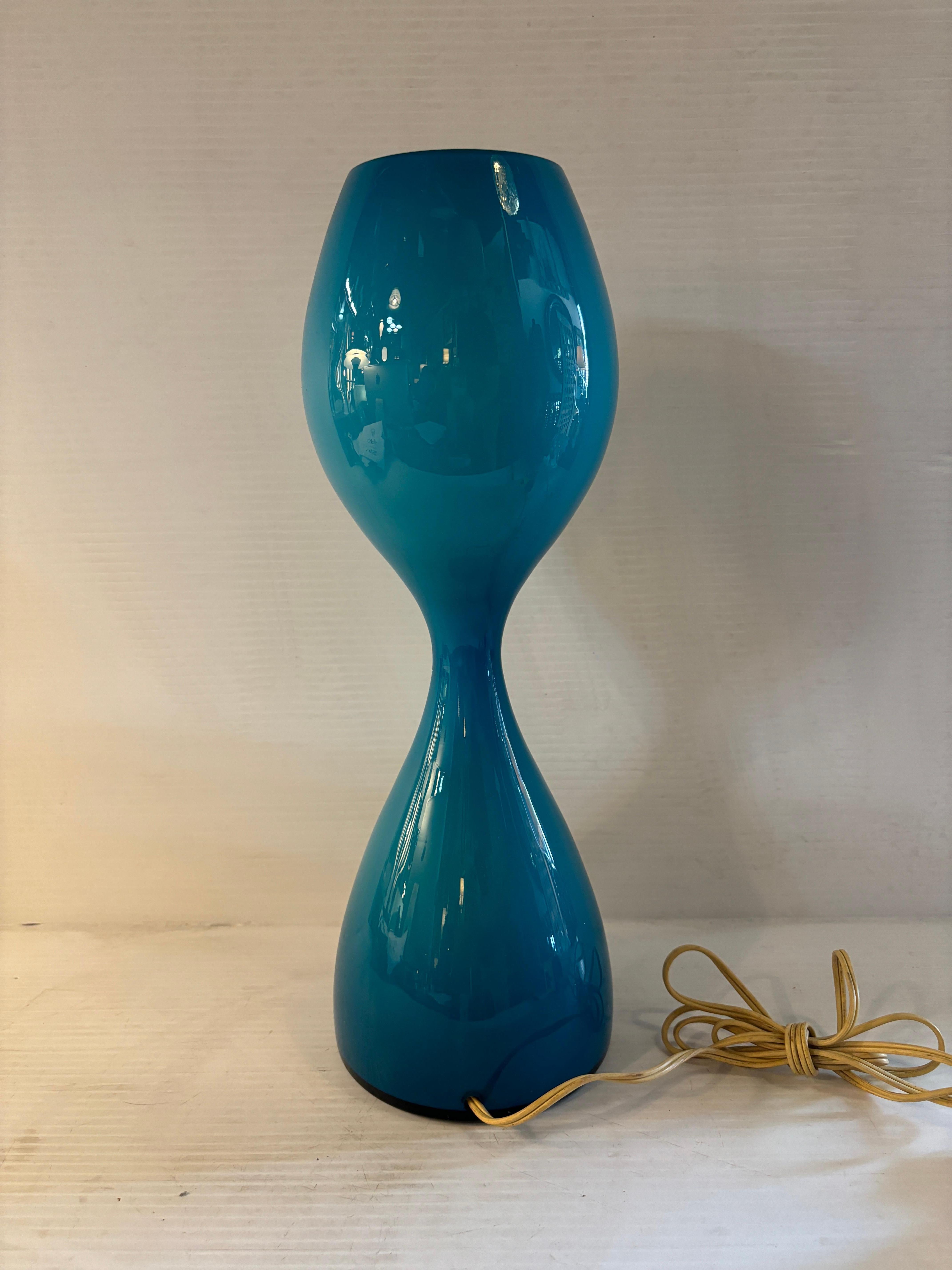 Vintage blown glass table lamp in sea blue with single bulb for warm lighting.
Please confirm location NY or NJ