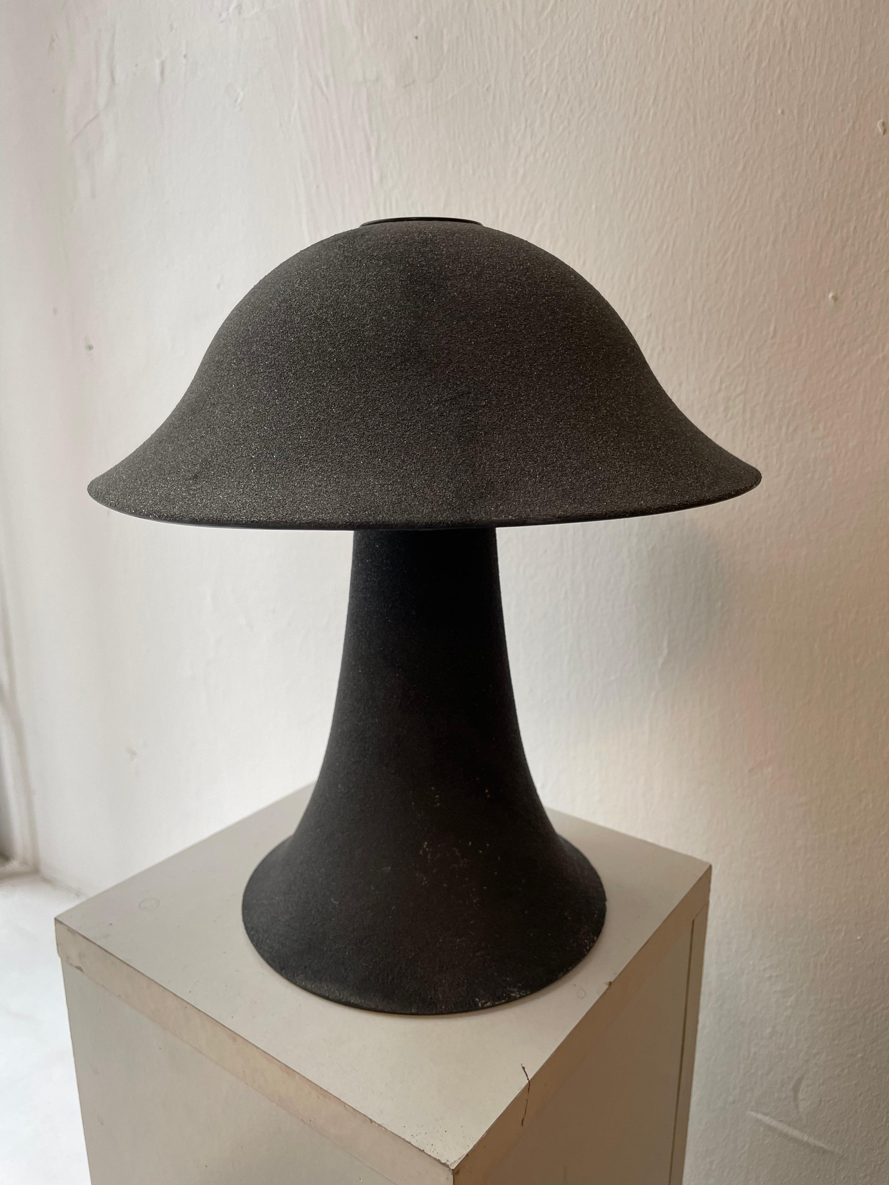 Peill & Putzler vintage ‘Mushroom’ table lamps made in Germany. Both lamps consist of a high-quality, hand-blown glass base and shade .The dark gray glass has an elegant textured satin finish.
