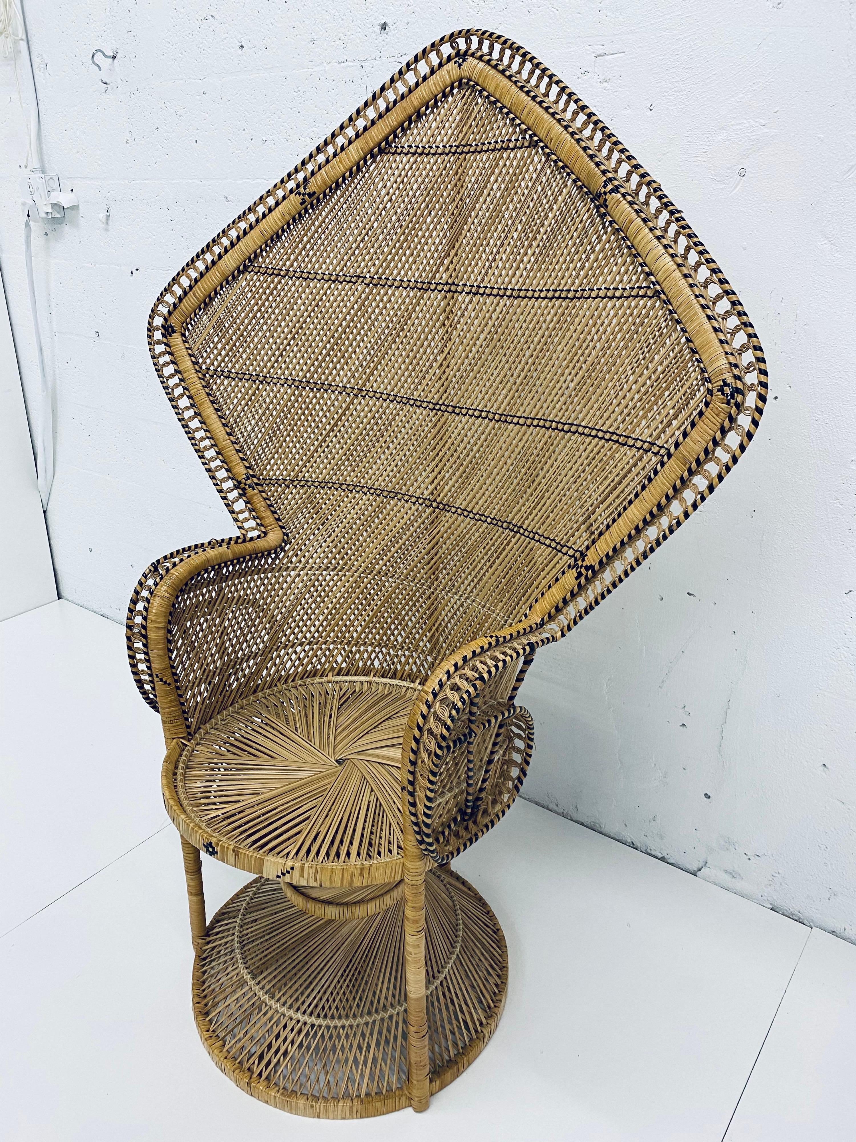 Vintage peacock angular chair in rattan from the 1970s. Rattan is in excellent condition with only minor wear.
