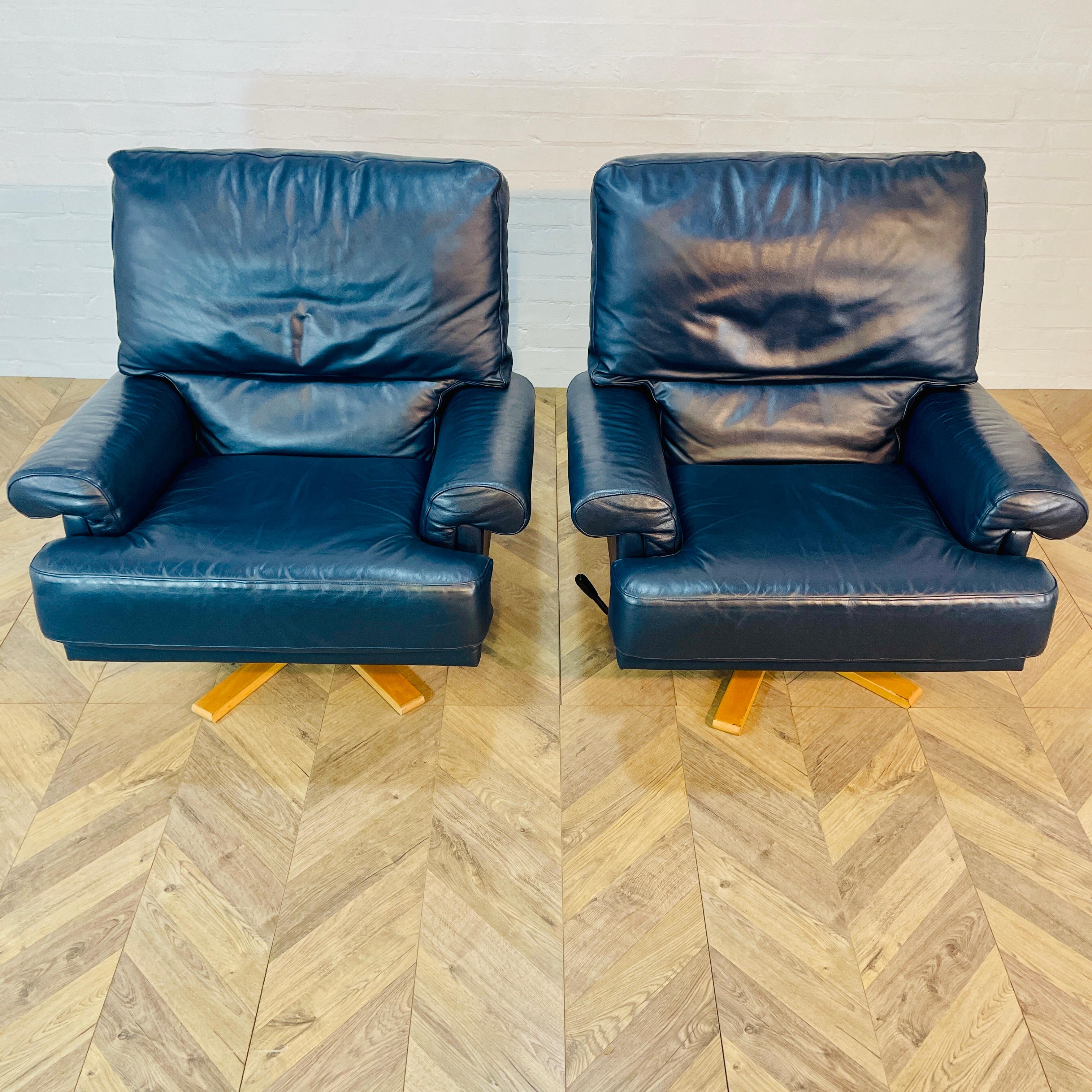 Large and Super Comfortable Pair of Matching Swivel Chairs, circa late 1970s / early 1980s.

The set is made from a soft navy leather material and in very good condition, with only slight marks and scuffs, in-keeping with their age and usage (as