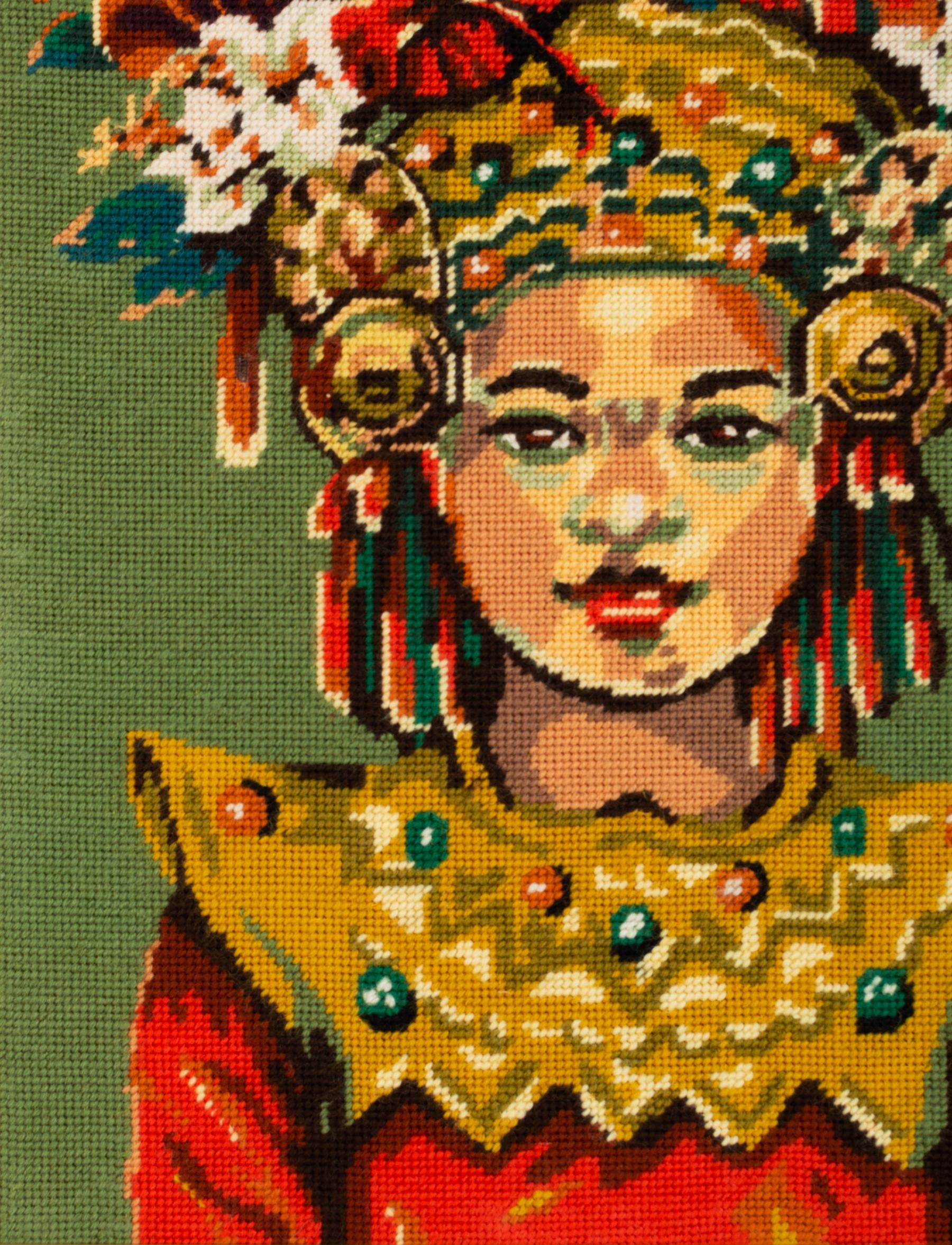 A mid century needlepoint French tapestry dating C.1960.

Beautifully executed in wool, depicting a South American woman with ornate head piece.
Strong, bold colours that have been well preserved.
Framed.
  