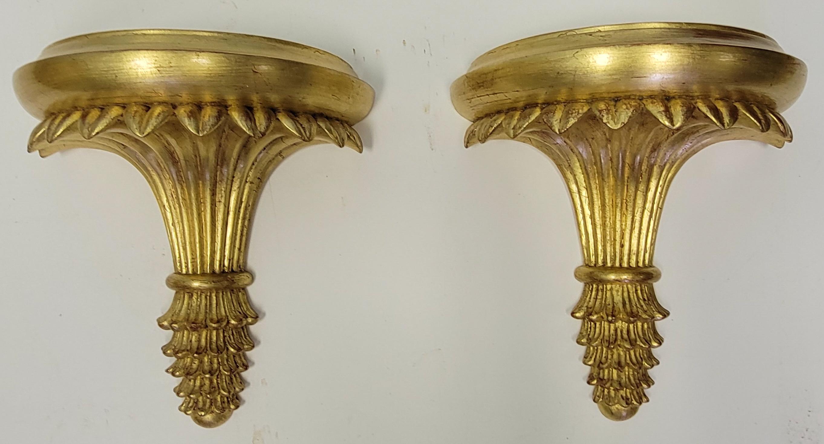 This is a set of four neo-classical style Italian giltwood wall brackets in very good condition. They are unmarked and in very good condition.