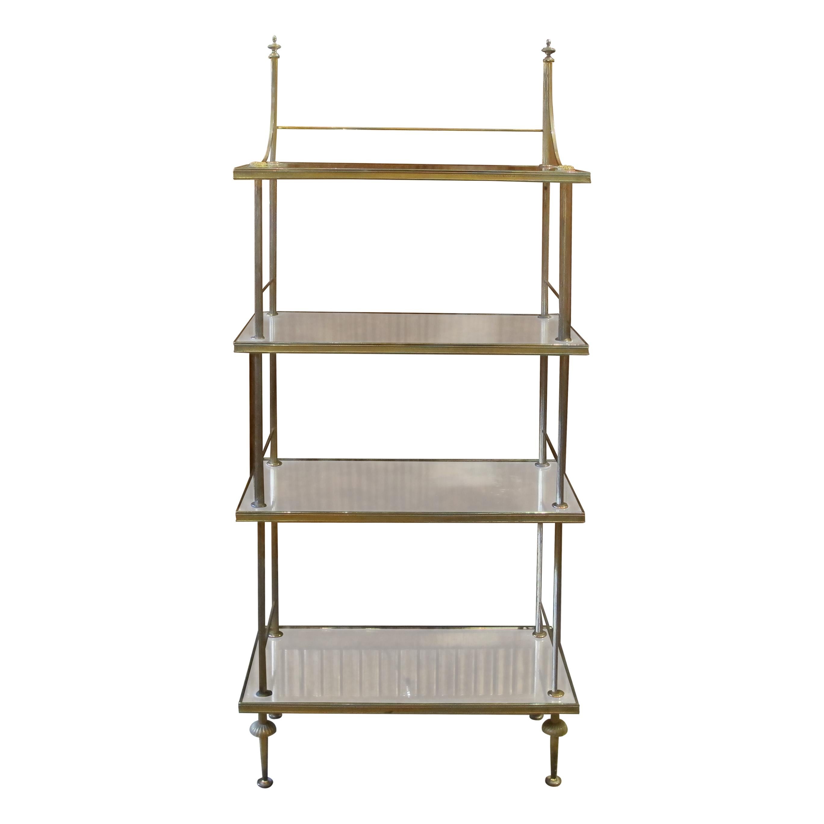 1950s Neoclassical rare model four-tier étagère/shelving unit by Maison Baguès with antiqued mirrors and patinated brass frame with acorns. The elegant design of the étagère makes it very versatile and can be used in any room to complement any
